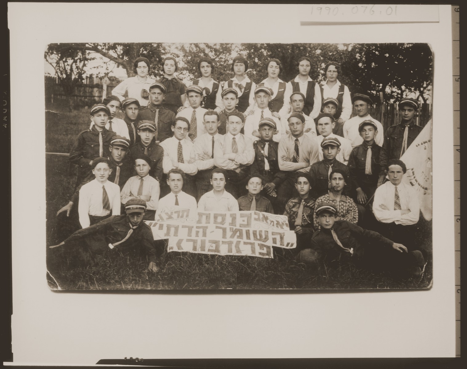 Group portrait of members of the Hashomer Hadati religious Zionist youth group in  Przedborz, Poland.