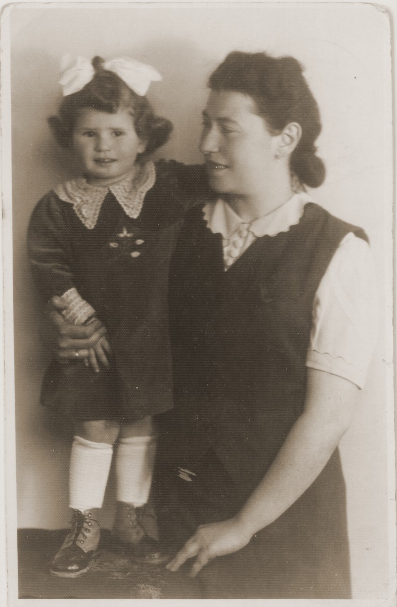 Studio portrait of a mother and daughter in the Tarnow ghetto.

Pictured are Helena (Amkraut) Lusthaus with her daughter, Elzbieta.