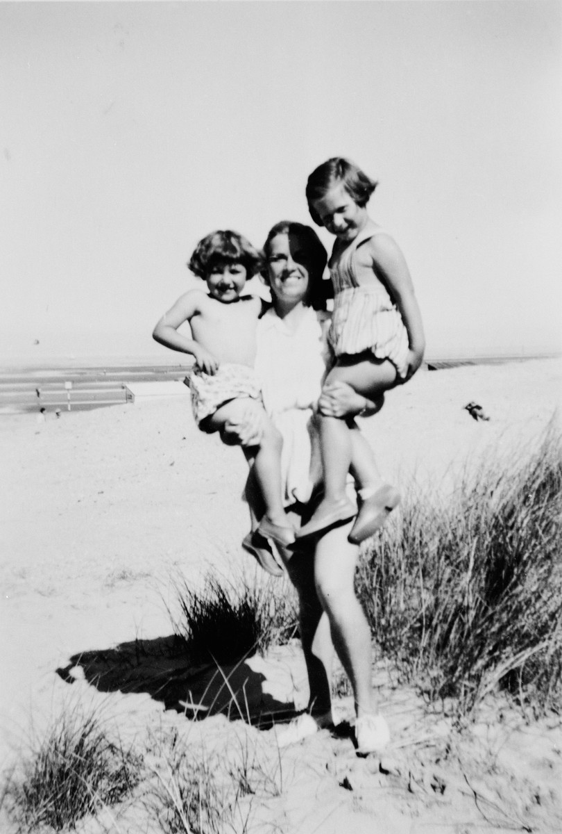 Andree Geulen holds two young children whom she helped rescue during the war.