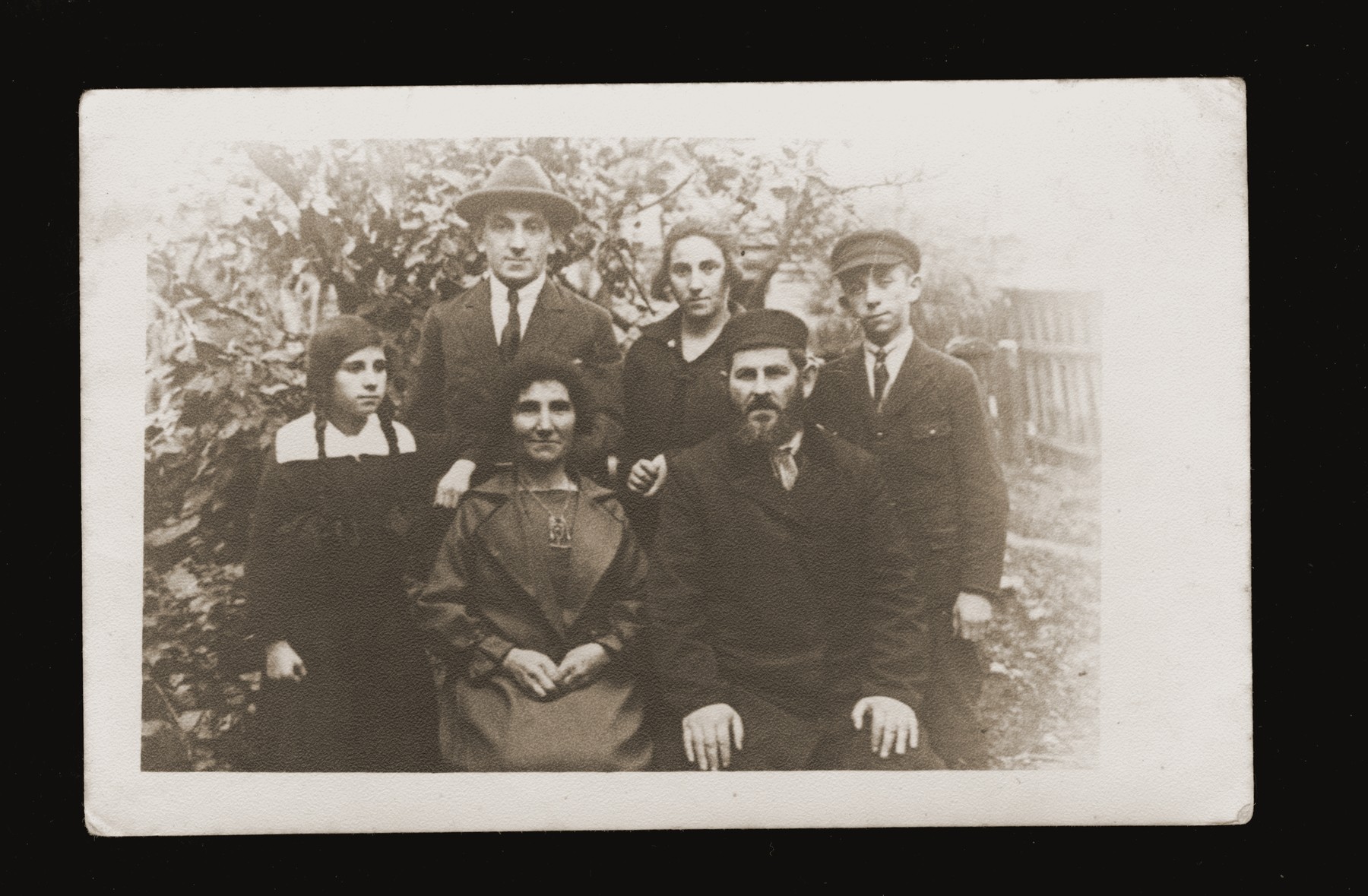 Portrait of the Gerlic family in their garden in Bedzin.

Pictured are Zishe Gerlic, his wife Sheine Esther, daughters Beltsha and Chava, and sons Velvel and Yehiel.