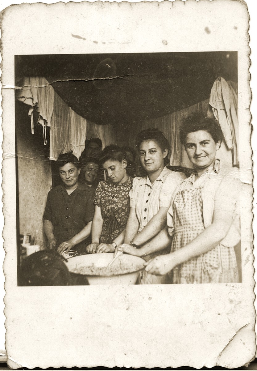 A group of women work in the kitchen of Kibbutz Magshimim.

Esther Urman is pictured on the far right.