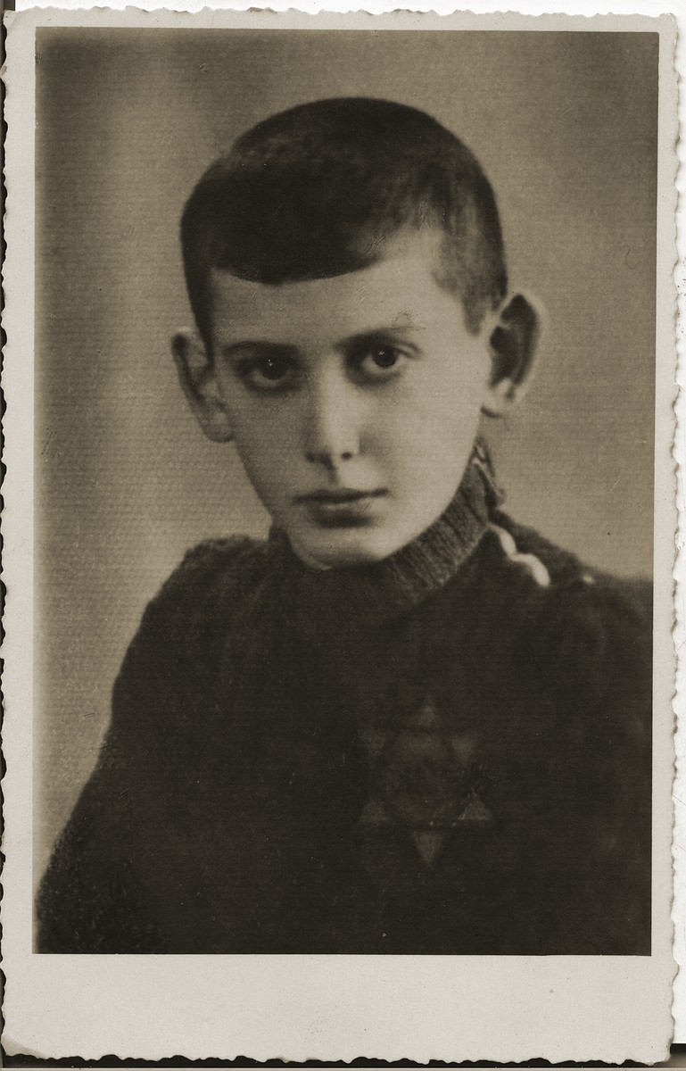 Portrait of an unidentified youth wearing a yellow star in the Bedzin ghetto.