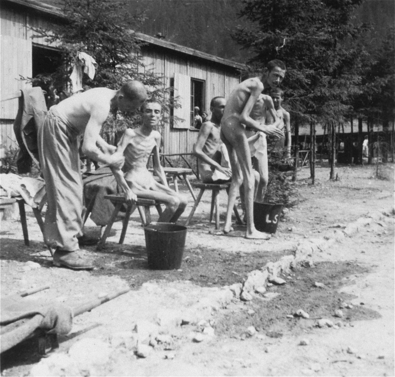 Survivors bathing after liberation, but prior to the install