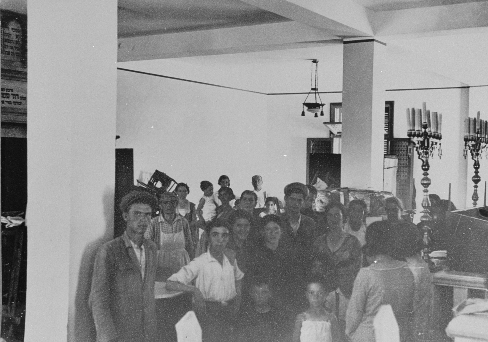 Jewish families take refuge in a  synagogue in Salonika after the pogrom at Camp Campbell.