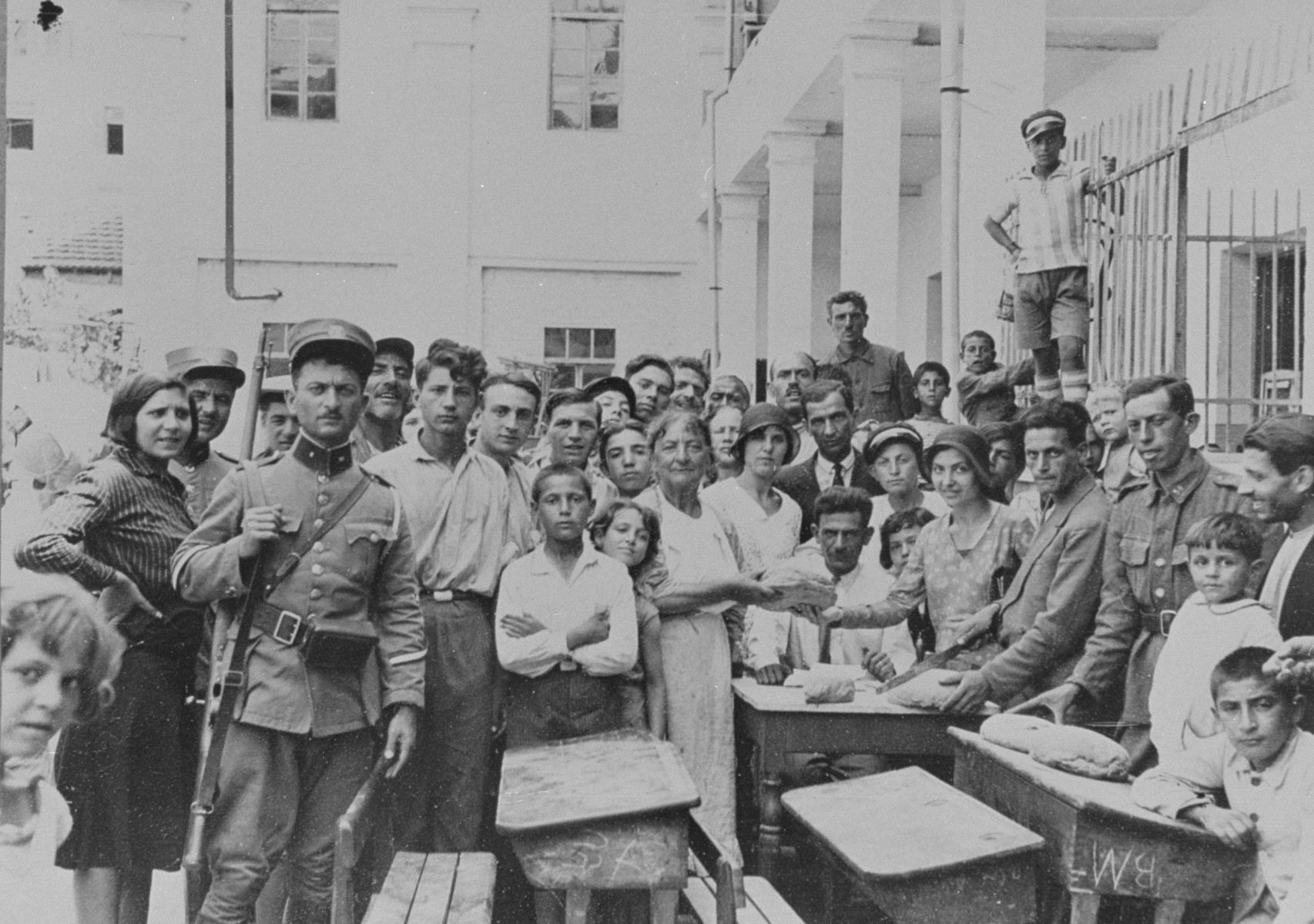 Jews take refuge in one of the local schools after a pogrom destroyed their community.