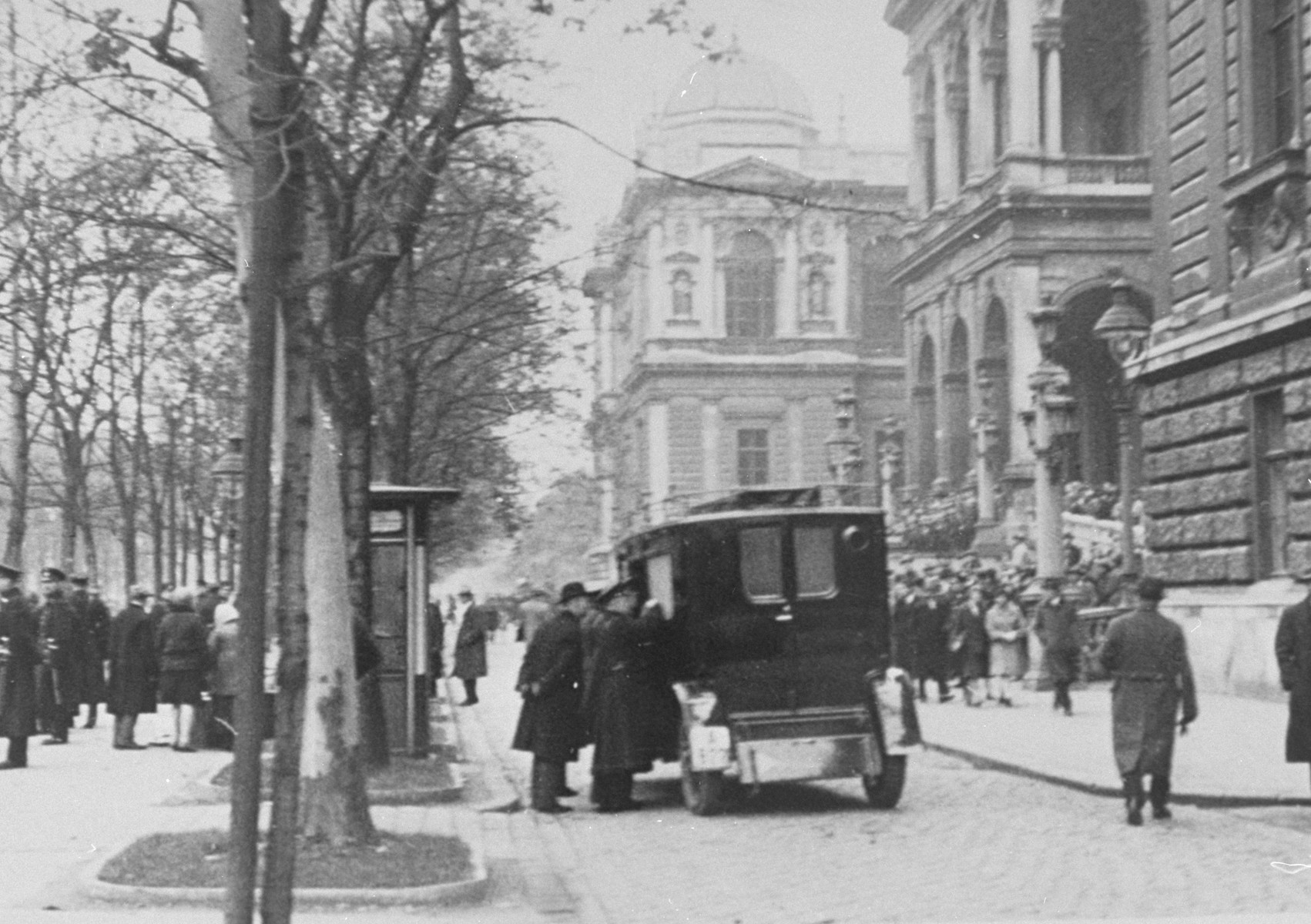 An ambulance takes students wounded during riots at the University of Vienna to the hospital. The riots occurred after Nazi attempts to prevent Jews from entering the University.