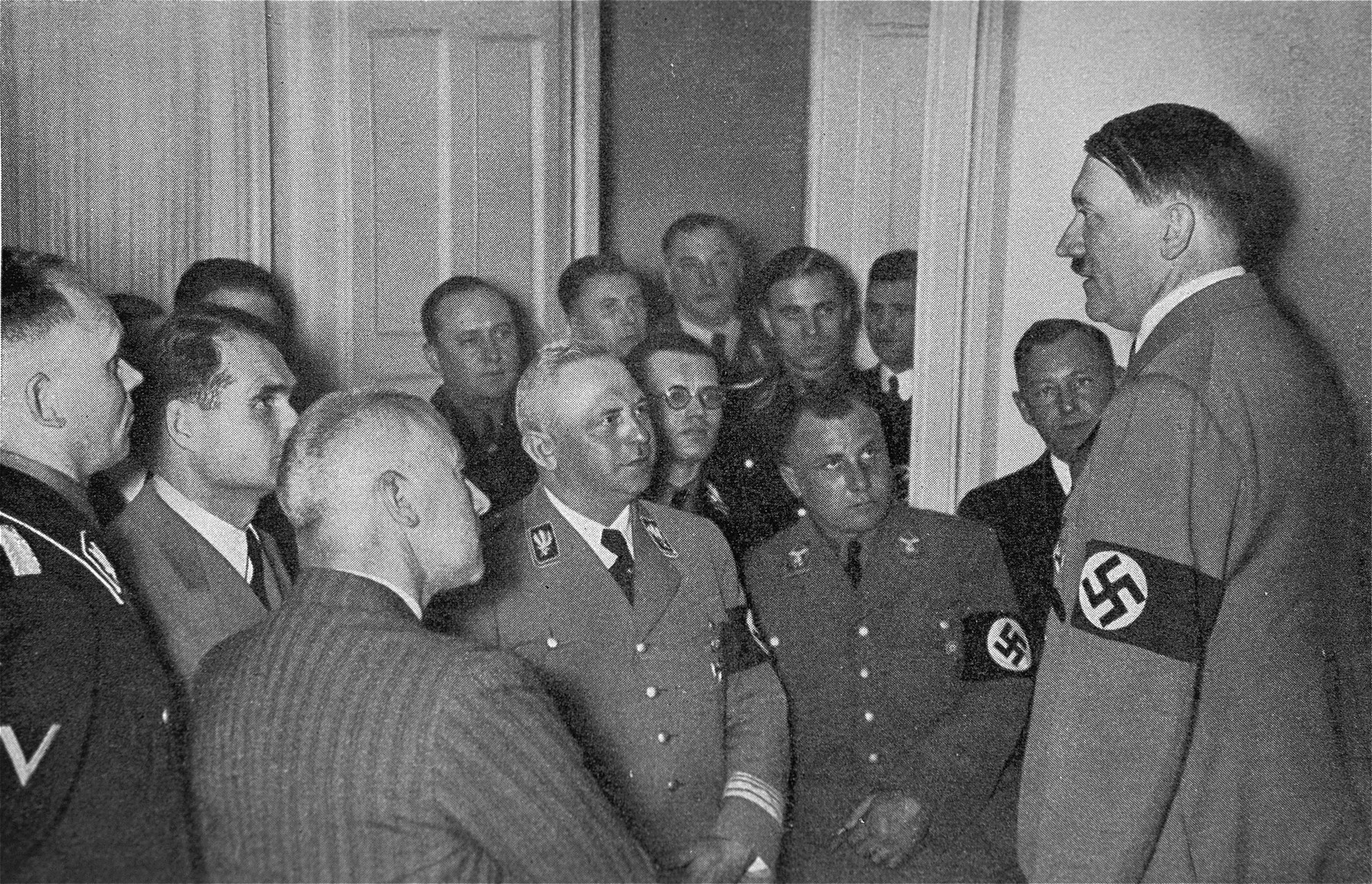 Adolf Hitler speaks to his closest associates on the evening of the Reichstag elections of March 29, 1936.
