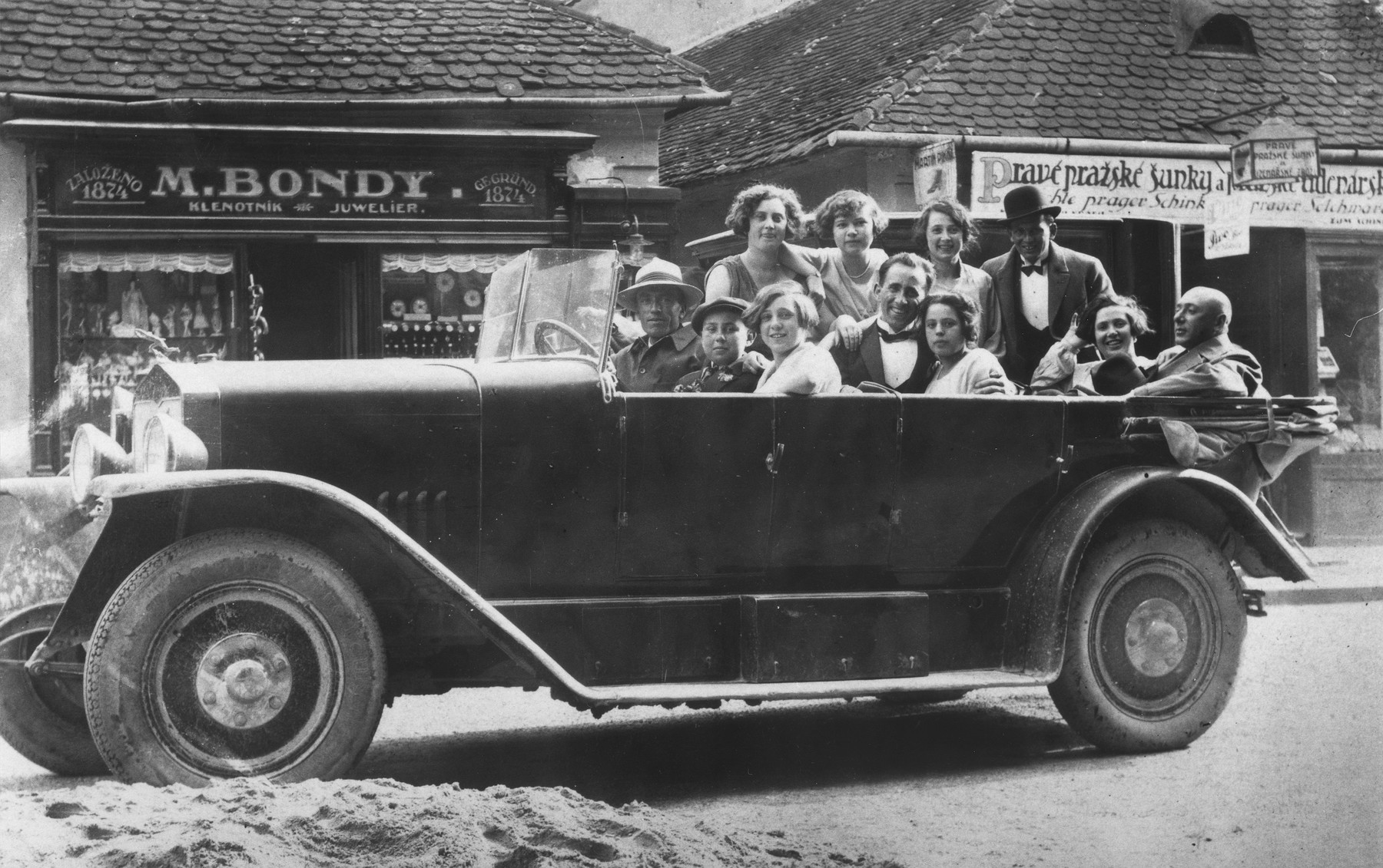 The Beck family goes for a ride in a large automobile.

Among those pictured are Margit, Erwin, Olga, Bela, Fredericka and Ilona Beck.