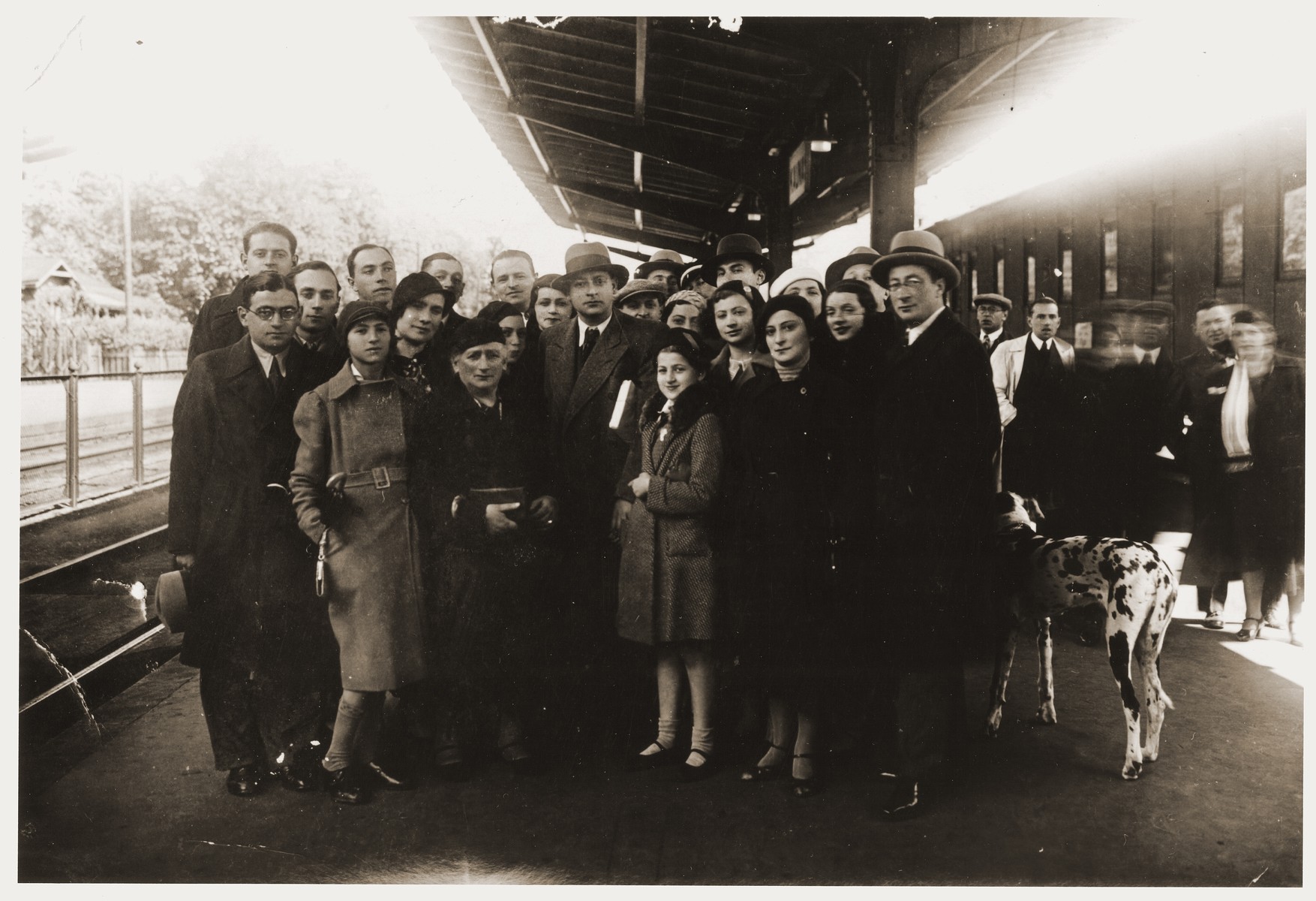 The Virovitch family gathers at the Kovno train station to bid farewell to Abrasha Virovitch who was immigrating to Palestine.

Abrasha was one of six children born to Malka Virovitch (pictured third from the left).  His brothers were Salamon, Liova, Isaak and his sisters were Rebecca Giniene and Bertha Jurovitzki.  The entire Virovitch family including Rebecca's two daughters Sara and Alice gathered to wish Abrasha well.  In Palestine, Abrasha married Fania, and the two returned to Kovno in 1939 to pay the family a visit.  Once the war started, he was unable to return to Palestine.  He and his brothers, Salamon and Isaak, were murdered three days after the German invasion of Lithuania, June 23, 1941, when Lithuanian partisans entered the family's apartment, dragged out the men and shot them in the back yard.  Abrasha's young wife, Fania, was killed during the liquidation of the Kovno ghetto, but their daughter, Tania, born in 1941 survived in hiding.