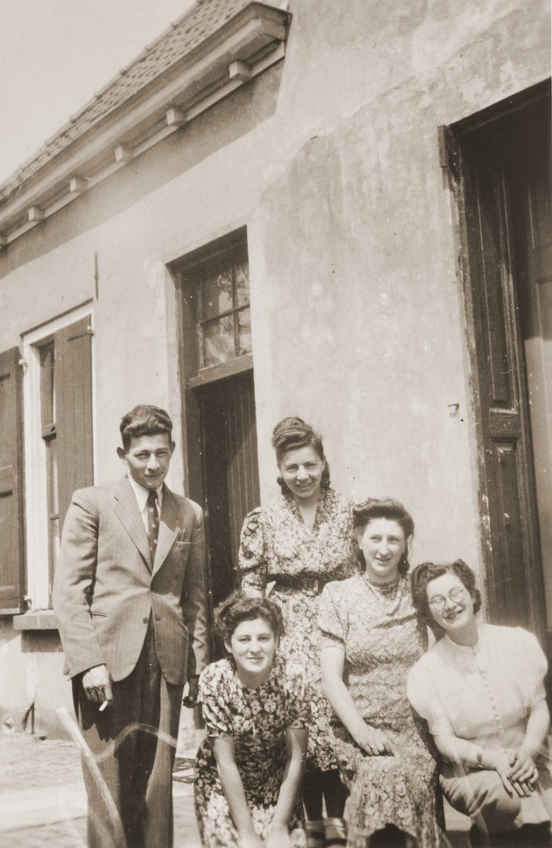A group of Jewish cousins pose outside the home of Louis Meijer in Boekelo.

Pictured clockwise from the top left are: Horst ? (fiance of Bettie Meijer); Bertha Berg; Bep Meijer; Bettie Meijer; and Sarie Berg.  Horst, Bettie and Bertha perished during the war.