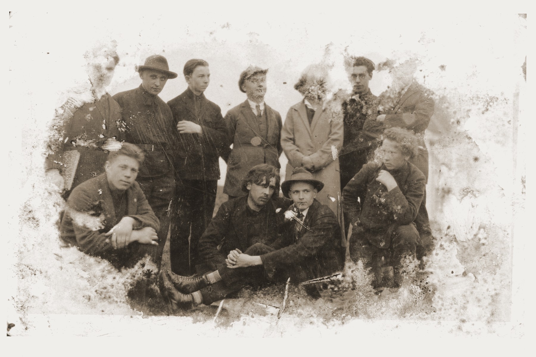 Damaged photograph of a group of artist friends in Kovno, Lithuania that survived the destruction of the Kovno ghetto.

Among those pictured is the artist Jacob Lifschitz (standing, second from right).  The photograph was buried with the artist's drawings shortly before the liquidation of the ghetto, and retrieved by his wife after the liberation.