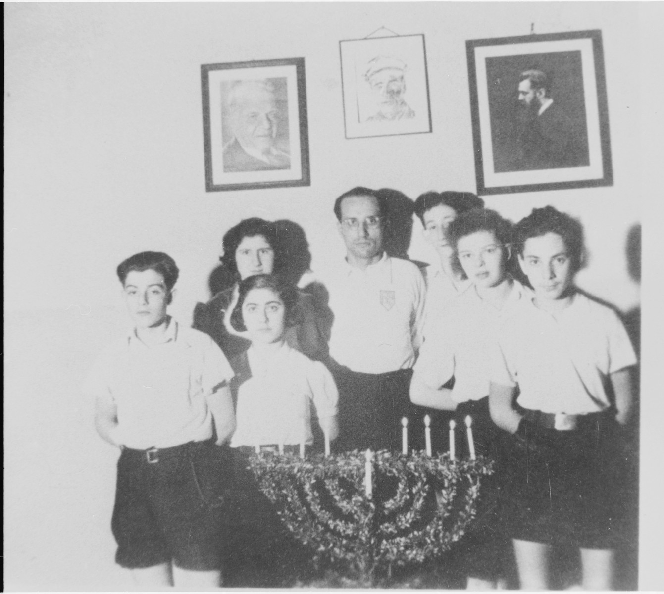 Jizchak Schwersenz (center) poses with some of his students during a Hanukkah celebration at the Youth Aliyah school in Berlin.