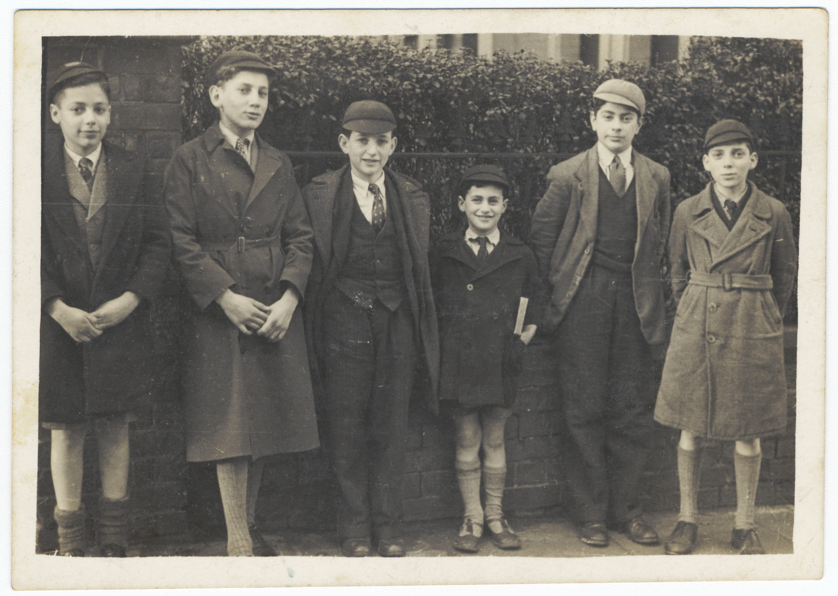 Six Jewish boys who came to England on a Kindertransport pose outside the synagogue in Nottingham.

From left to right are Martin Eiseman, Joseph Haberer, Lutz Goldner, Benjamin Bamberger, Henry Duckstein and Werner Cohn.