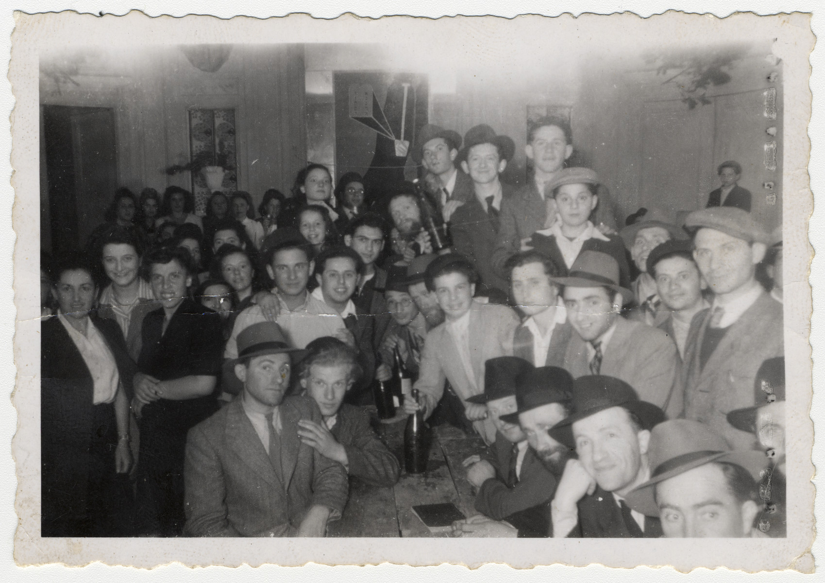 Orthodox displaced persons gather together for a celebration in Kibbutz Hafetz Hayyim in Nazzarno, Italy.

Kibbutz Hafetz Hayyim, named after the great rabbi, Rabbi Israel Meir Kagan, is the name given to a series of some fifteen religious kibbutzim founded by the Poalei Agudat Yisrael movement.