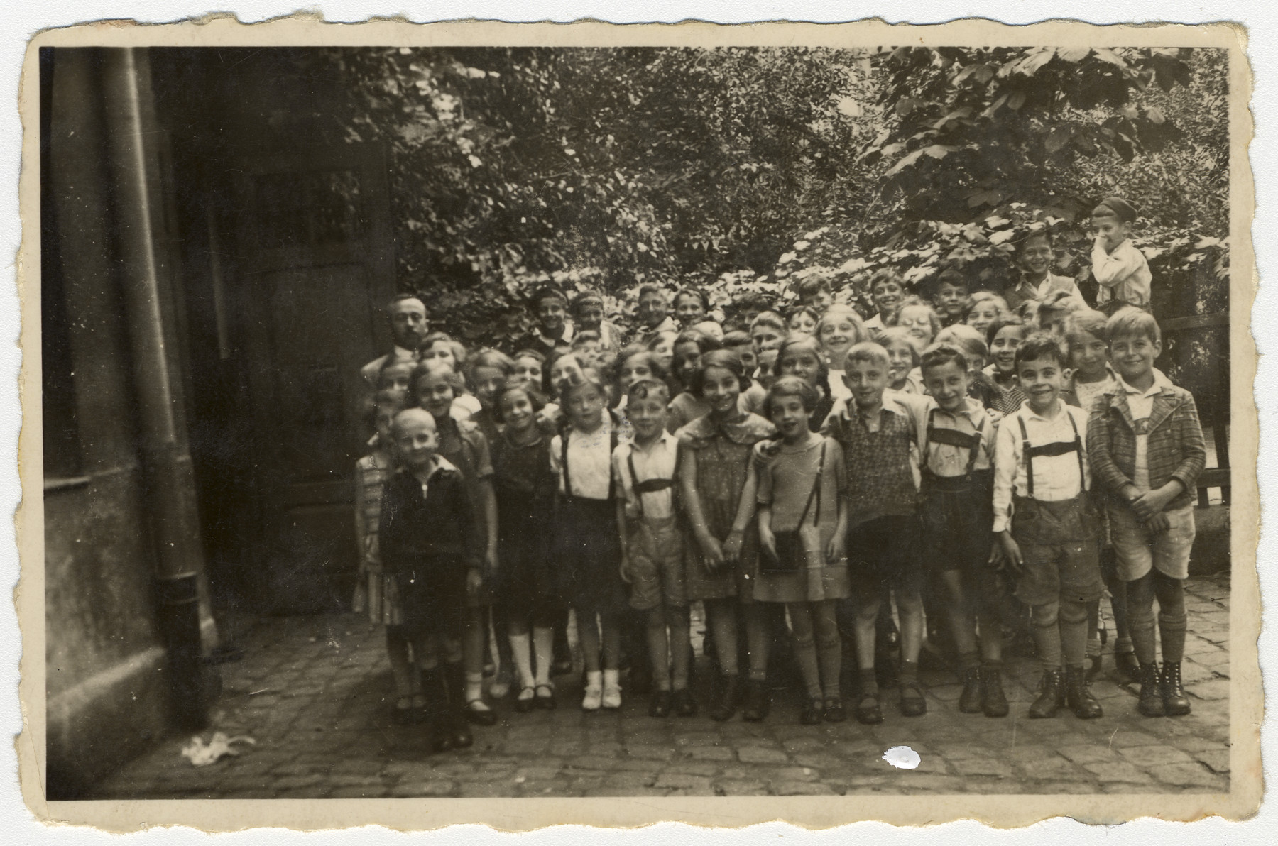 Group portrait of a second grade class in a religious elementary school in Nuremberg, Germany.

Among those pictured is Meir Schwarz, front row, fourth from the left.  Standing behind him is the teacher Mr. Blum.