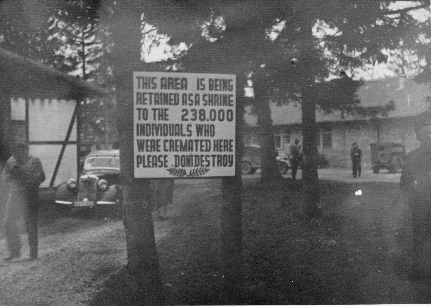 A memorial sign in front of the crematorium in Dachau.