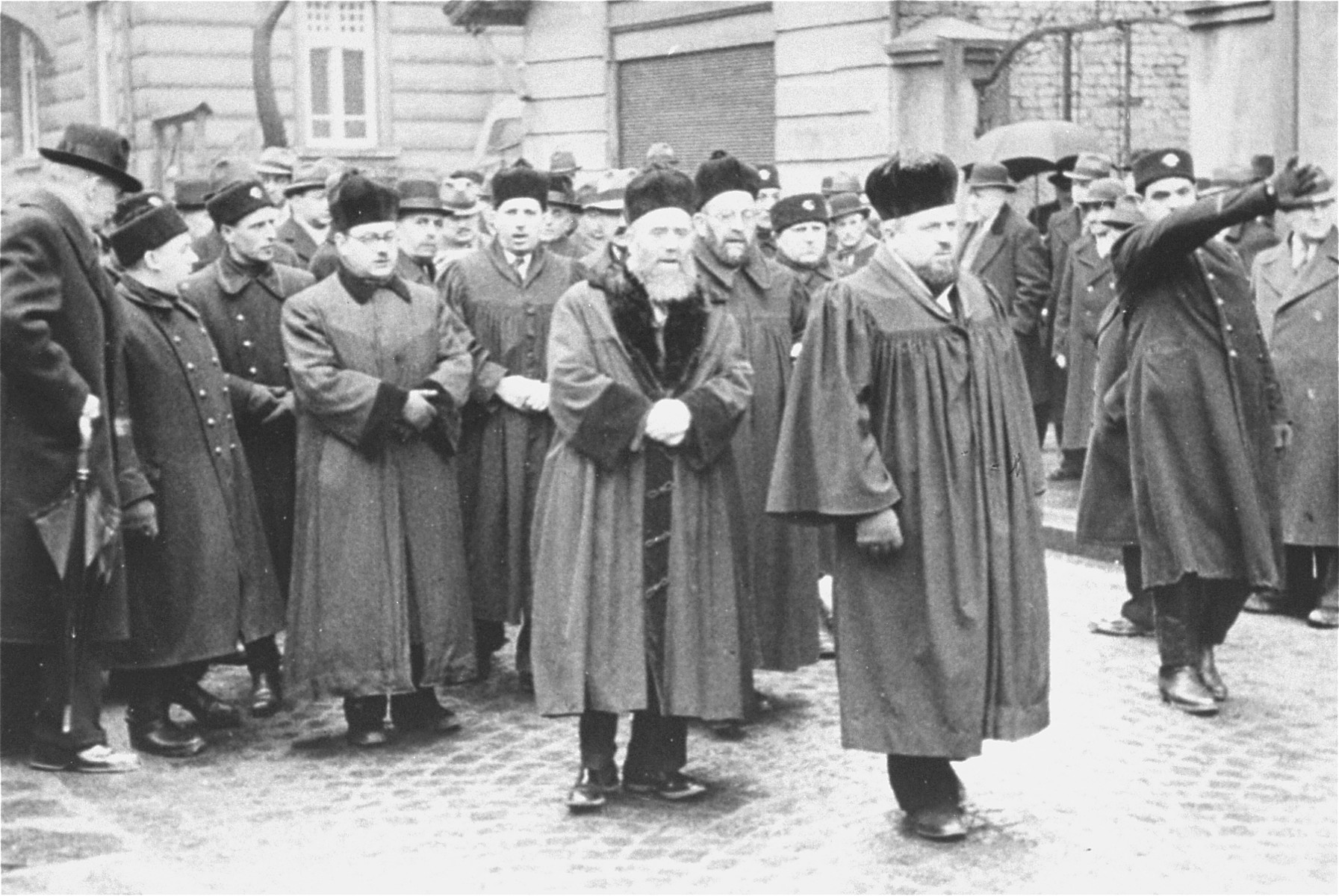 Dr. Asher Hananel, Chief Rabbi of Sofia (at the right in the foreground), leads a funeral procession for Nissim Yasharoff (the donor's grandfather) through the streets of Sofia.  The funeral took place a few days after the arrival of German troops in Bulgaria.

Also pictured is Rabbi Daniel Zion, Chief Rabbi of Bulgaria.