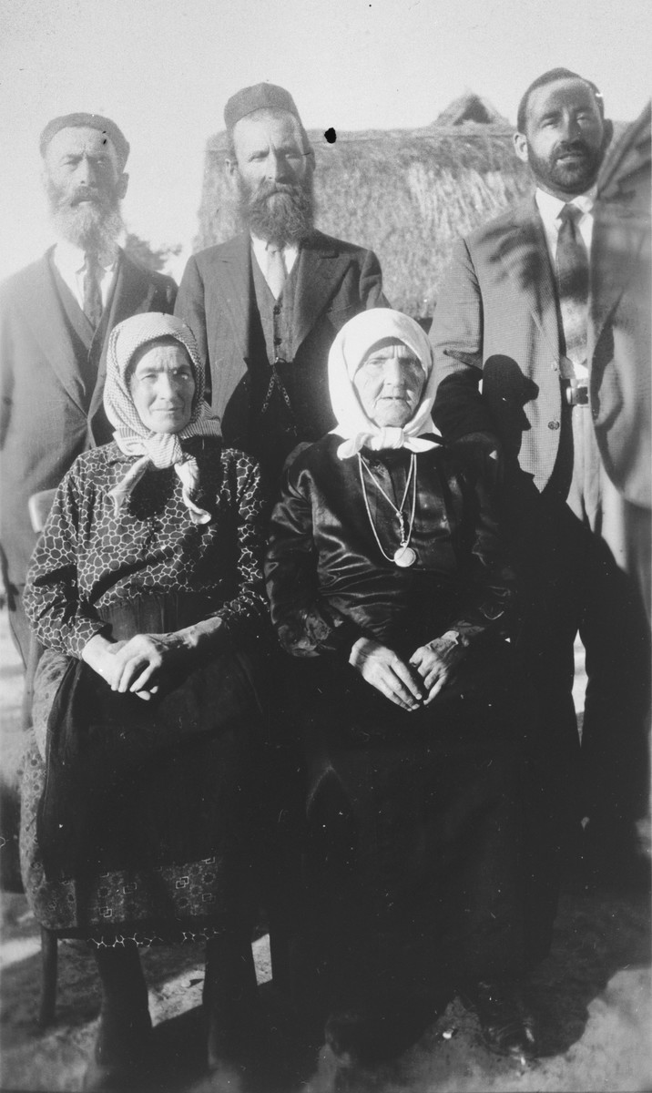 Portrait of Yetta Beila Gutman surrounded by brother Leib Schumer and children.

From left to right are Esther and Yetta Beila; standing, Leib, Aaron and Muttcha.