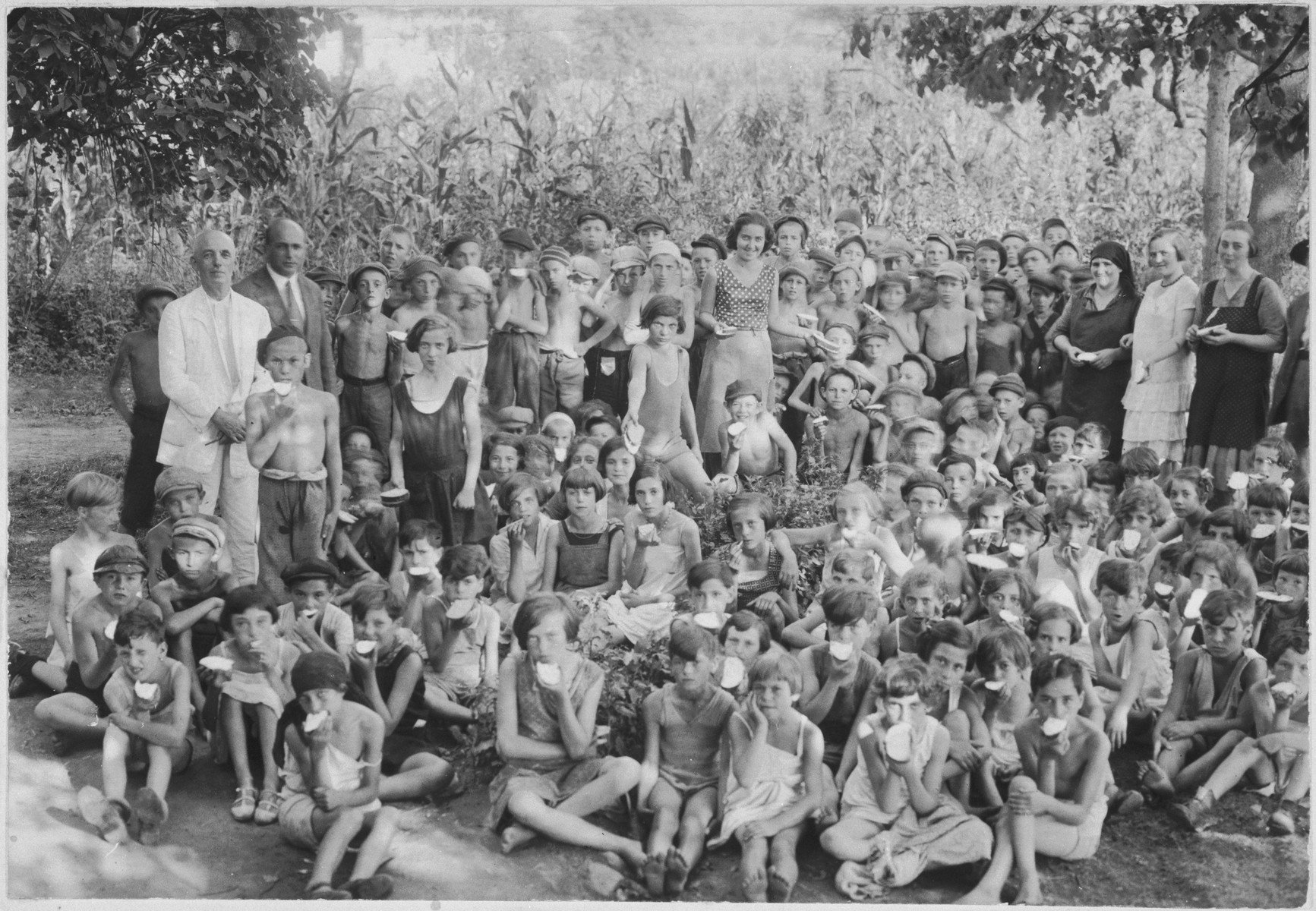 Children eat a snack of bread and butter in a summer camp in Sighet for indigent children.

Among those pictured are Chaim Davidovics, Schlesinger, Arthur Roth, Leiby Taback, Hershel Schwartz and Laizer Eizikovics.