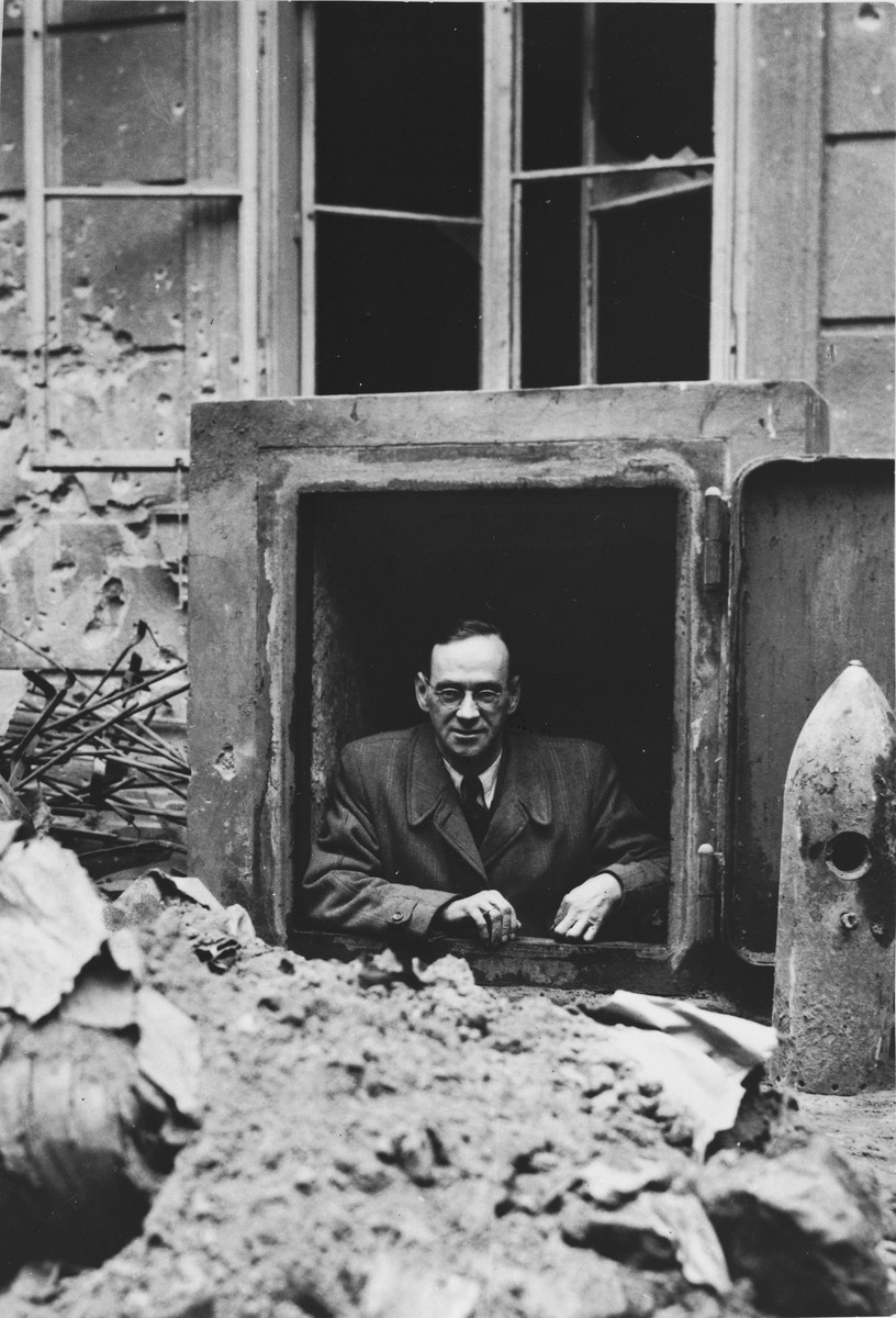 Charles (Carl) Lutz poses among the ruins of the former British legation in Budapest.