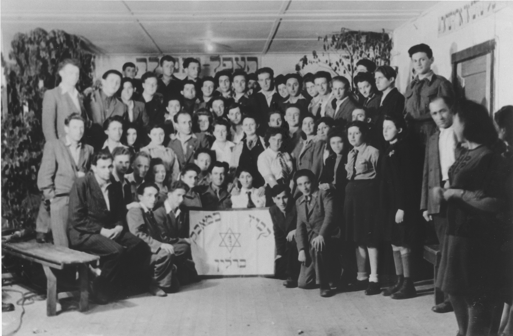 Group portrait of members of Kibbutz Be-Maavak [literally, the Kibbutz in struggle] in the Schlachtensee displaced persons camp.