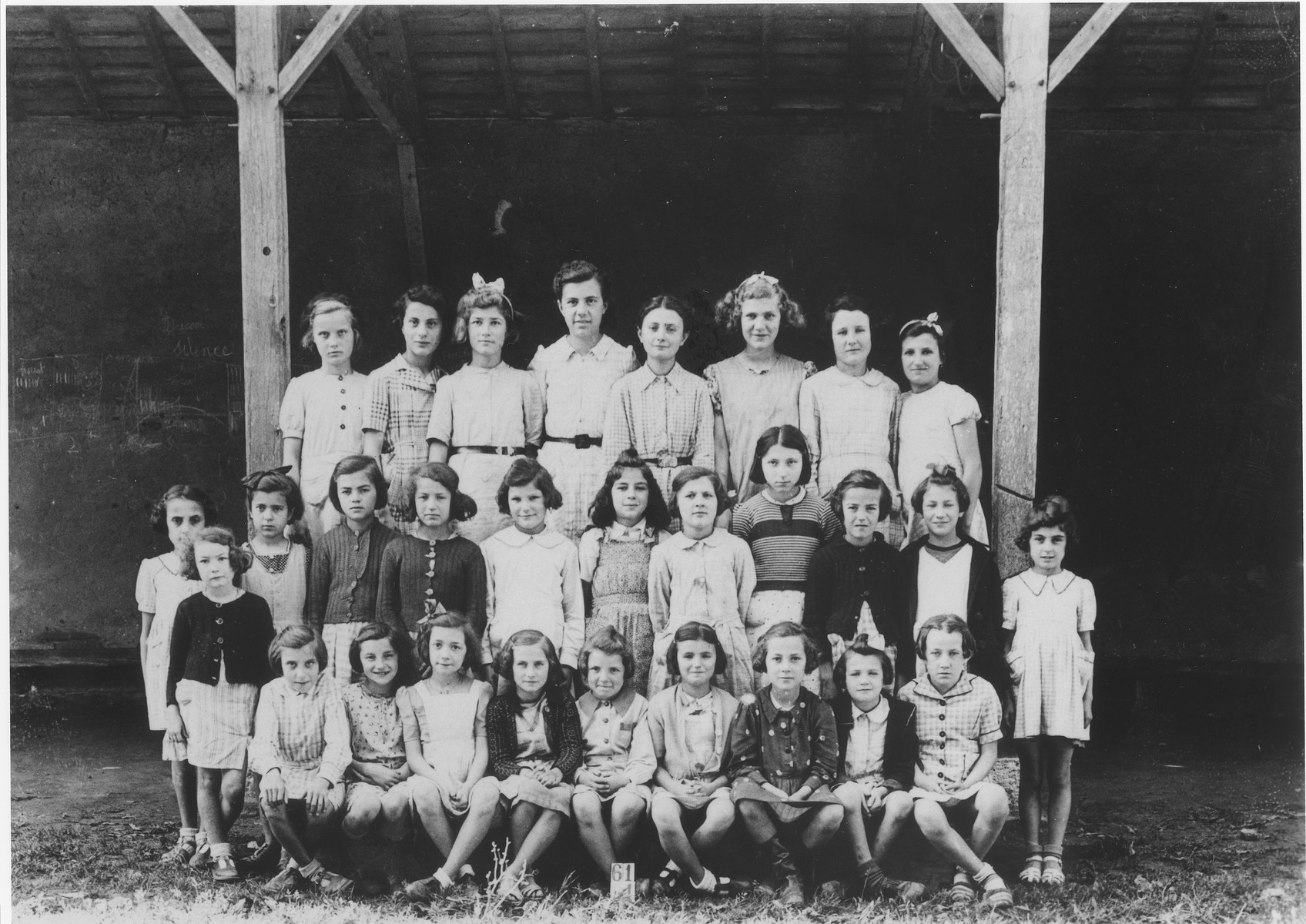 Jewish refugee children pose with their French classmates at a village school in Eauze, France.

Among those pictured are Berthe Silber (second row, second from the left); and Edith Steinfeld (standing third from the right).  Edith was subsequently deported to Auschwitz on convoy #29 from Drancy.