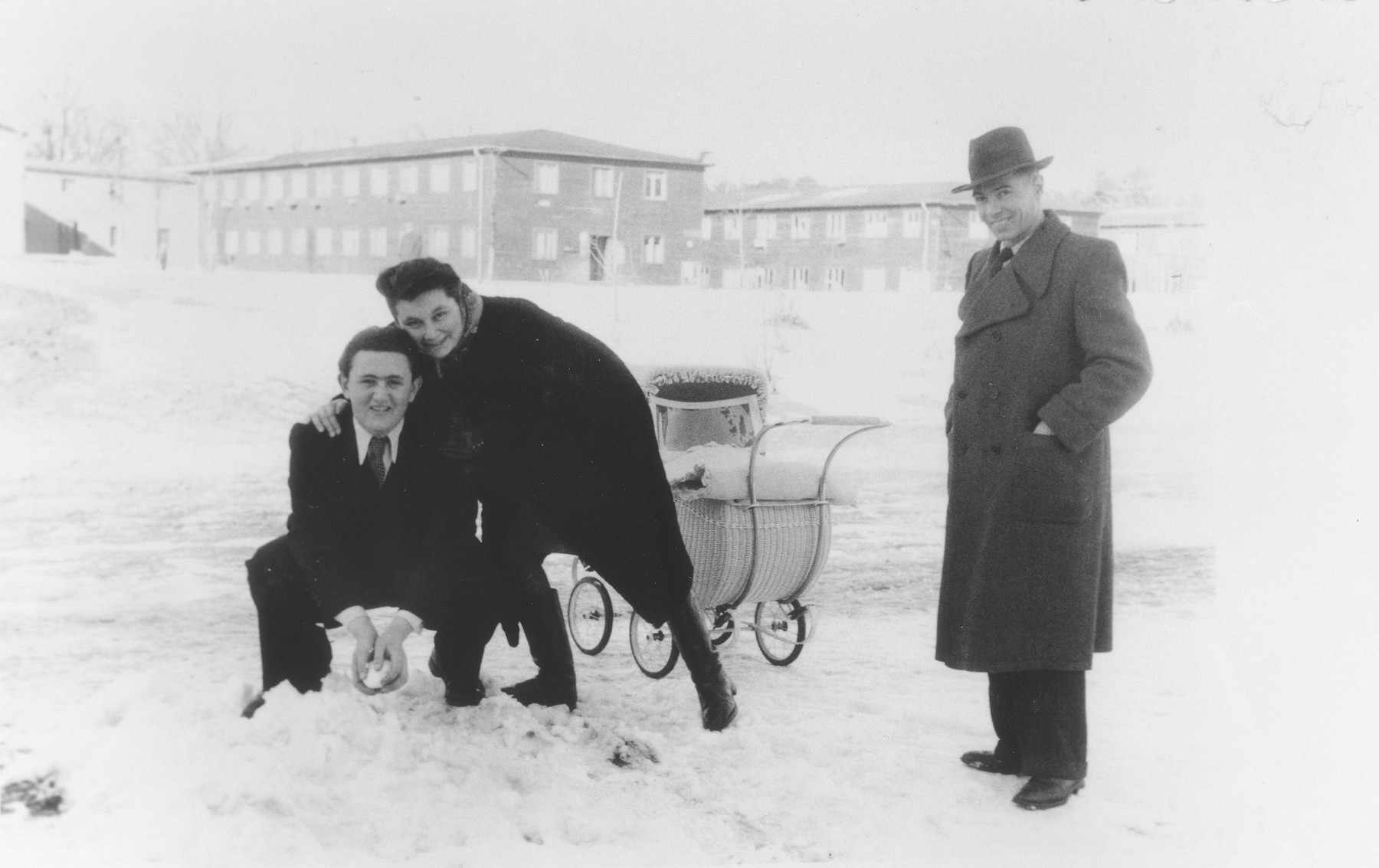 Yeshayahu Zycer plays in the snow with his teachers, Margot and Leonhard Natkowitz, at the Schlachtensee displaced persons camp.