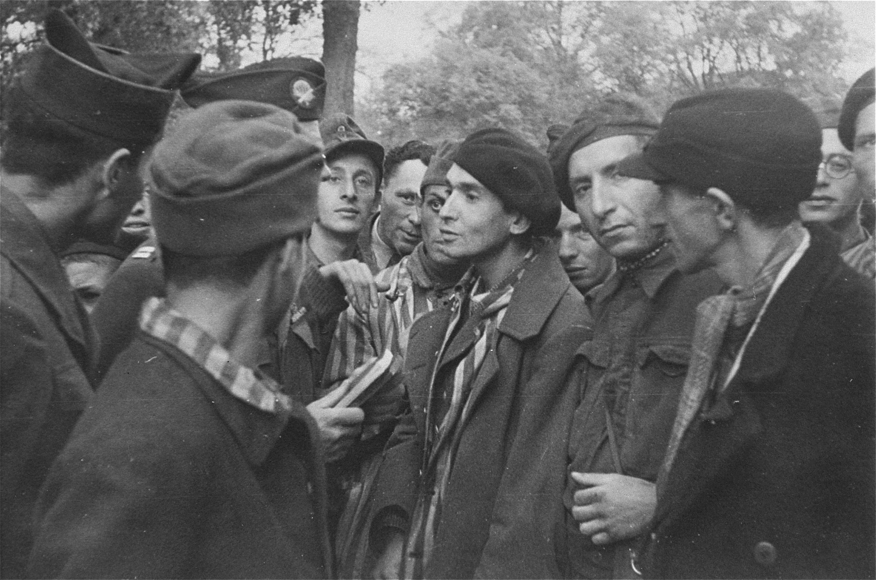 Survivors in Woebbelin speaking with their American liberators.