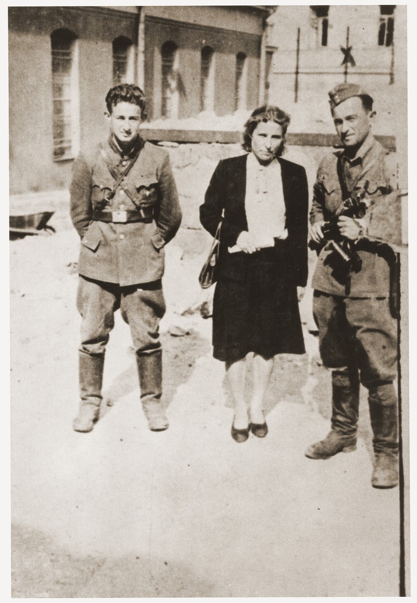 Three former Jewish partisans pose in the Vilna ghetto soon after the liberation.

Pictured from left to right are; Joseph Harmatz; Valia Pszewalska and Avraham Sabrin (the last commander of the partisan La Nitzachon battalion).