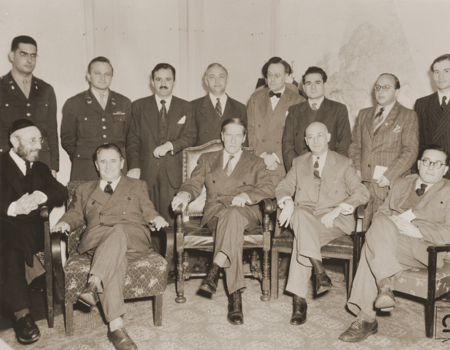 Group portrait of participants at a meeting between Jewish DP leaders and visiting American Jewish leaders in the American Zone of Germany.

Pictured in the back row, from left to right, are: Rabbi Herbert Friedman; Abraham Hyman; Isaiah Kennen; Philip Bernstein; Philip Forman; Leon Retter (Aryeh Nesher); Boris Pliskin; Rabbi Gerhard Rose. In the front row from left to right, are: Rabbi Samuel Snieg; Nahum Goldmann; Rabbi Stephen Wise; Jacob Blaustein; and Samuel Gringauz.