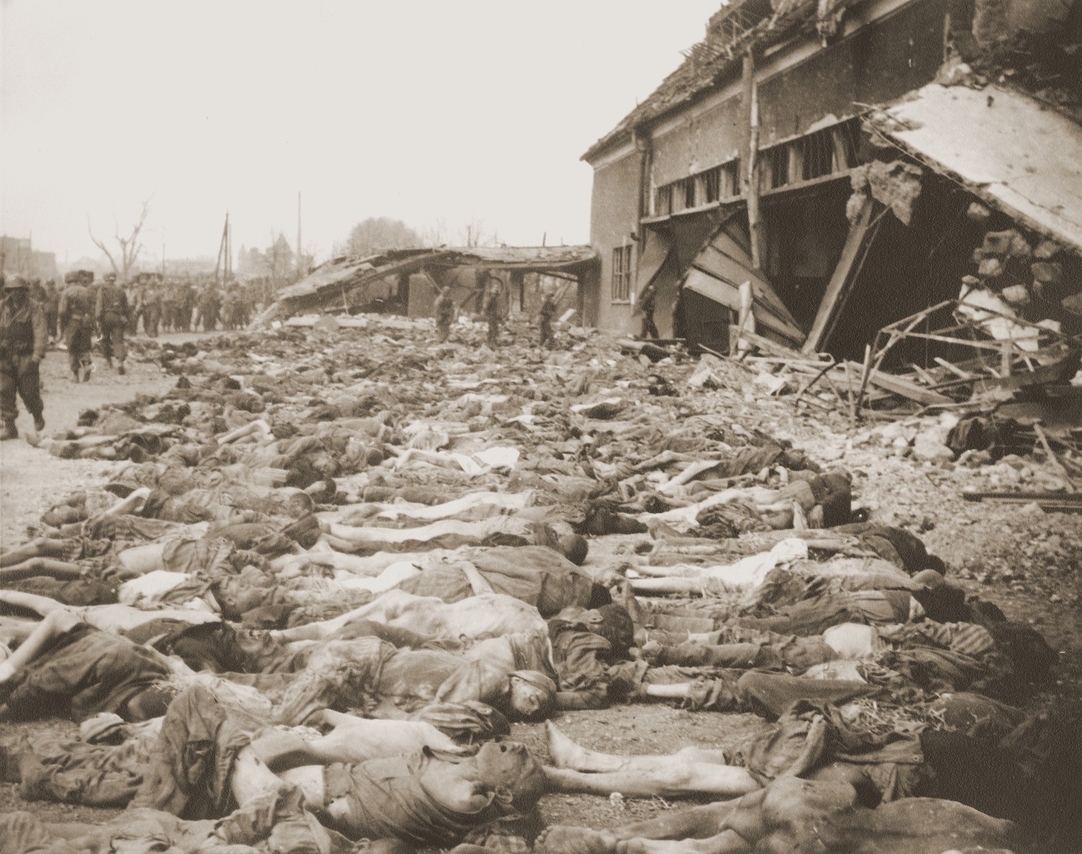 The bodies of prisoners killed in the Nordhausen concentration camp, which have been laid out in long rows outside the central barracks (Boelke Kaserne).