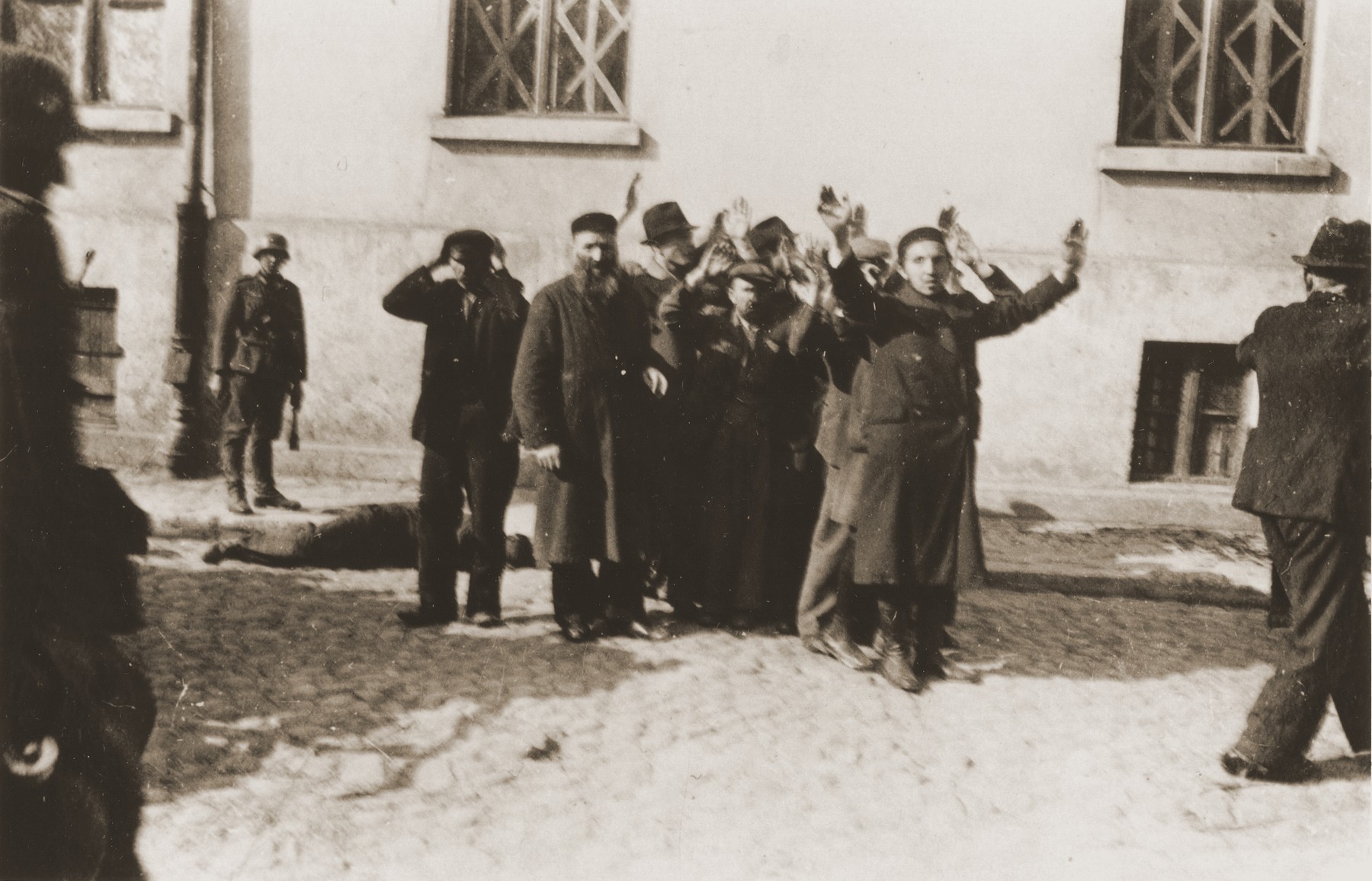 German soldiers round-up a group of Jewish men on Strazacka Street in Czestochowa.

One photograph from an album belonging to a member of a Wehrmacht machine gunners' unit, which was found after the war by Lorenzo Hawkins (the donor's grandfather), an American serviceman in Company B, 56th Armored Engineer Battalion.