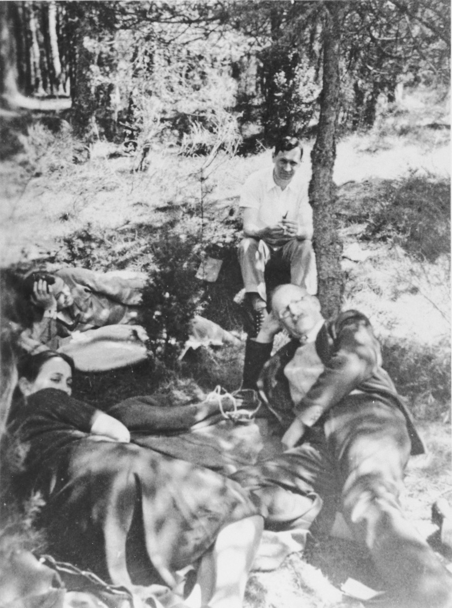 Pastor André Trocmé and assistant pastor Edouard Theis relax with their wives under a tree in the woods.

Pictured clockwise from the top are: Edouard Theis, André Trocmé, Magda Trocmé, and Mildred Theis.
