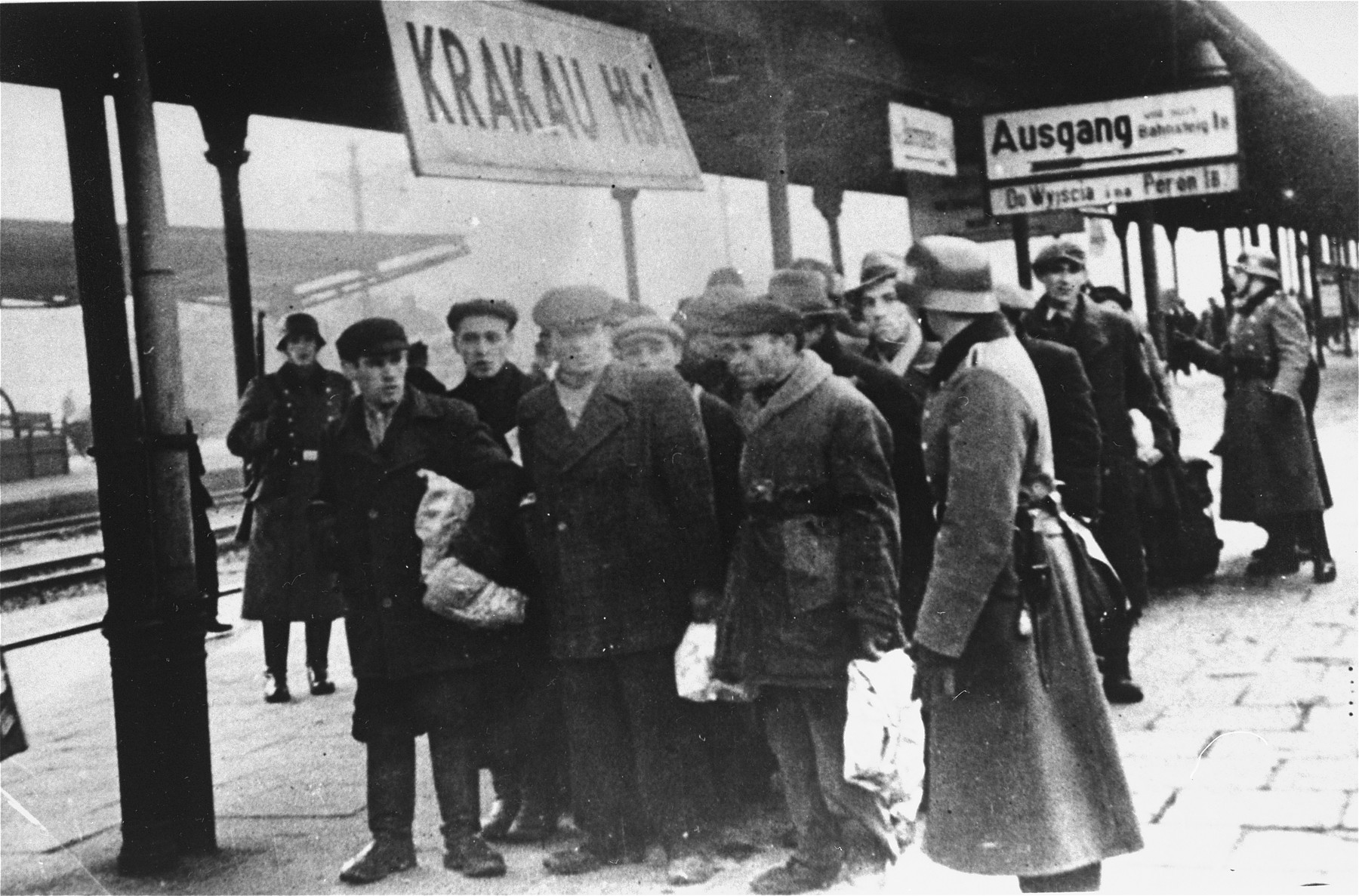 Jews assembled for deportation wait on the platform in the railway station for further transport.