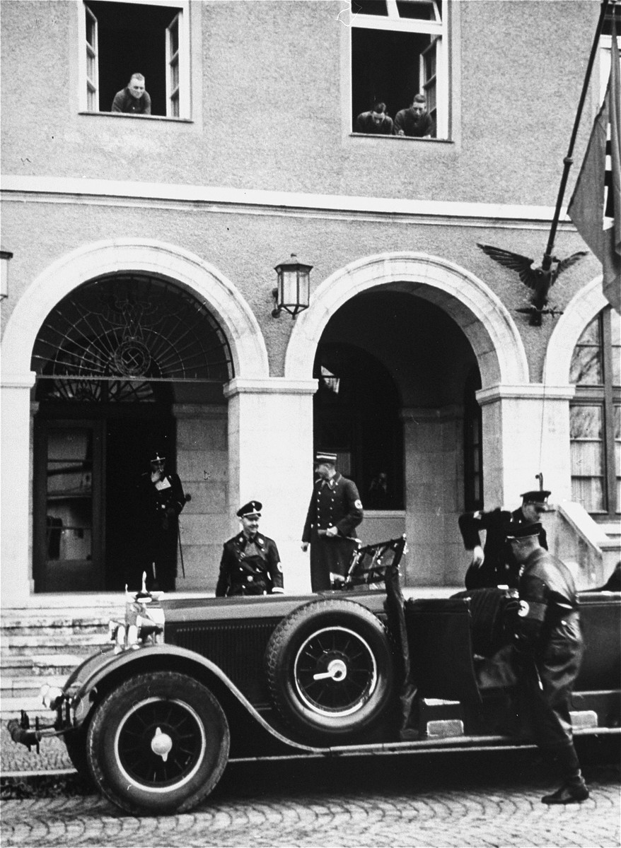 Heinrich Himmler walks to his car.  This image is from an album of SS photographs.