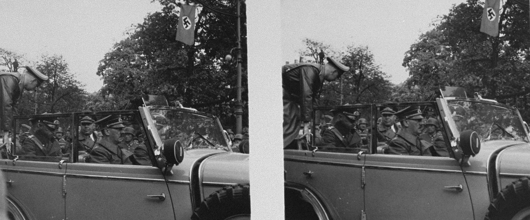 Stereoscopic photograph of Adolf Hitler and other Nazi officials leaving the viewing stand following a victory parade in Warsaw celebrating the German conquest of Poland.
