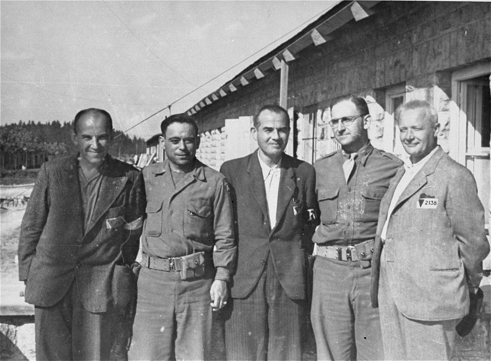 Mauthausen survivors pose with two American soldiers.

Pictured from left to right are: George Havelka from Prague; Jack Nowitz; Martin Ernor from Insbruck; Major Eugene Cohen (donor), and Joseph Ulbrecht, a former bank director from Prague.