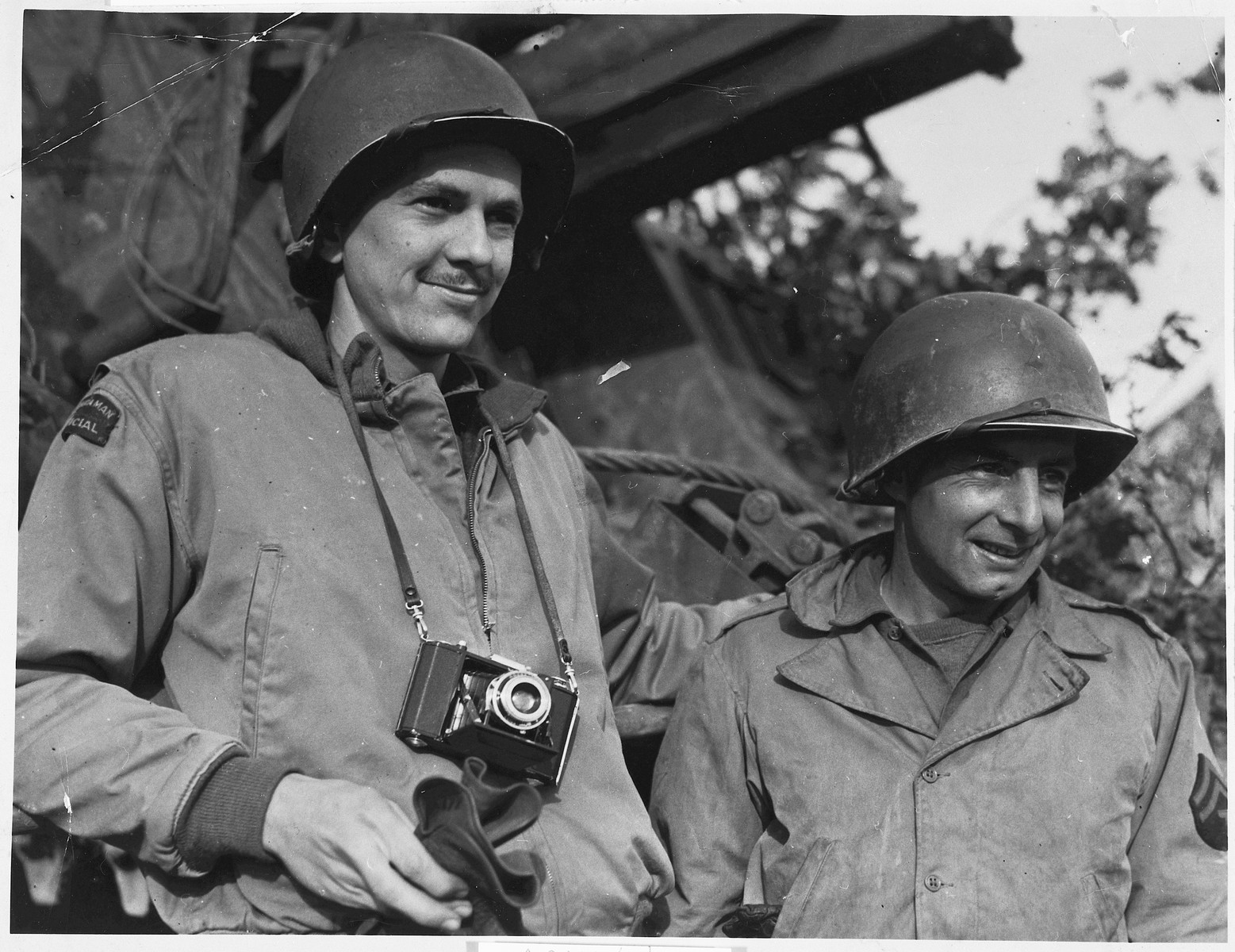 Portrait of two American soldiers from Tacoma, Washington serving in the U.S. Army in Europe during World War II.

Pictured are combat photographer, Arnold E. Samuelson (left) and Marvin R. Carter, an artilleryman attached to the same unit.