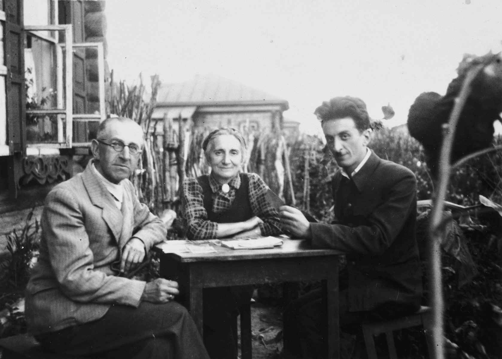 The Rafes family poses outside their home in the Ural Mountains where they were evacuated to during the war.

Pictured are Helena, Yulian and Itzhack Rafes.