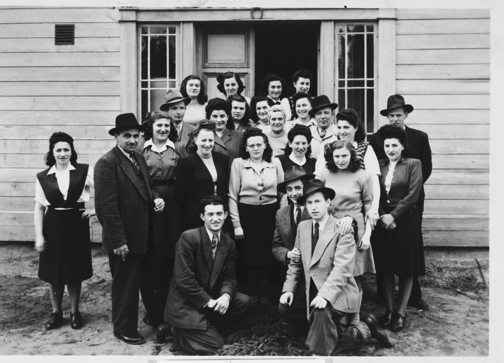 Group portrait of religious Jewish displaced persons in Sweden.

Regina Pollack is pictured in the third row, second from the right.