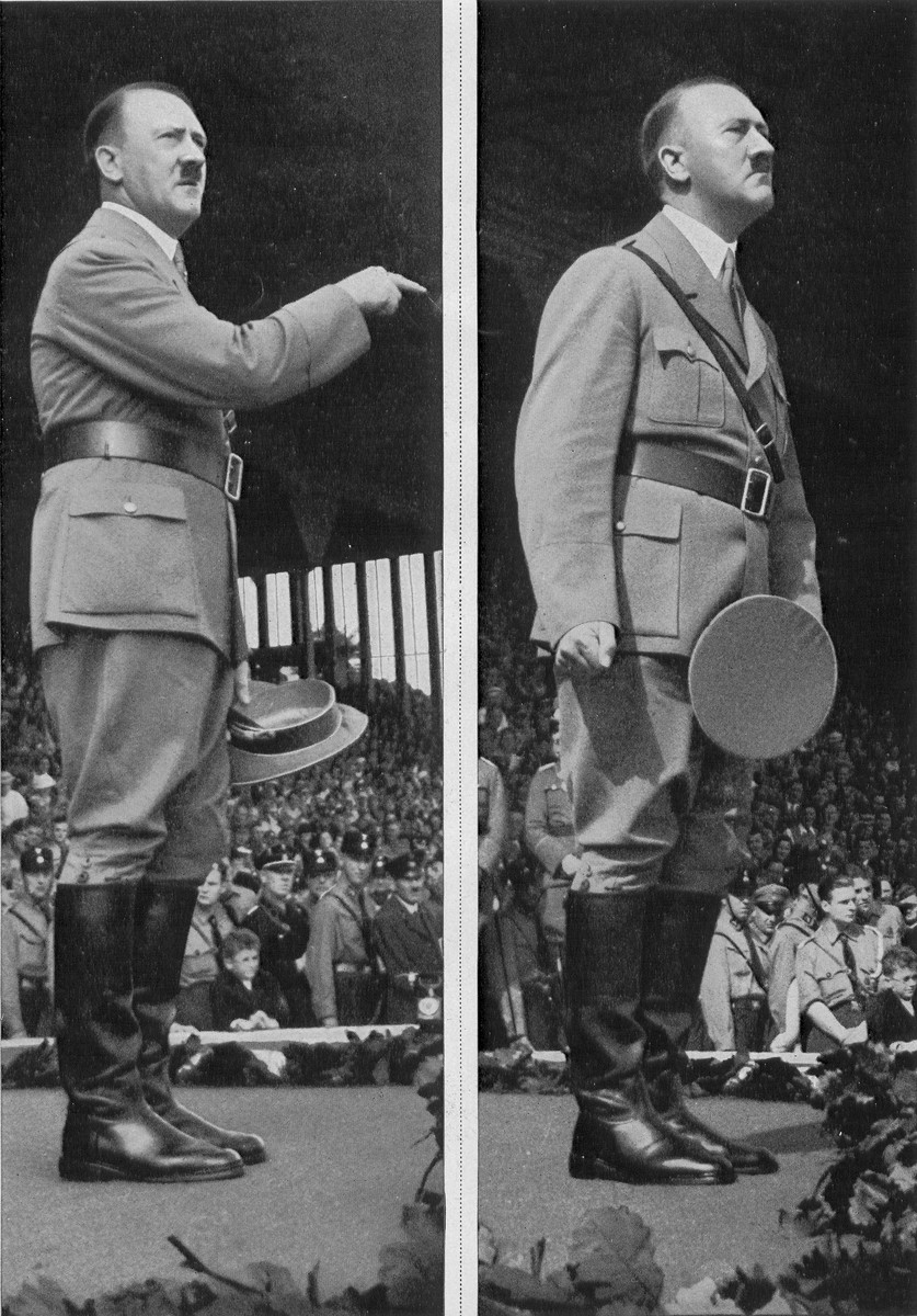 Chancellor Adolf Hitler stands on the podium before a crowd of youth during a Reichsparteitag (Reich Party Day) ceremony in Nuremberg.