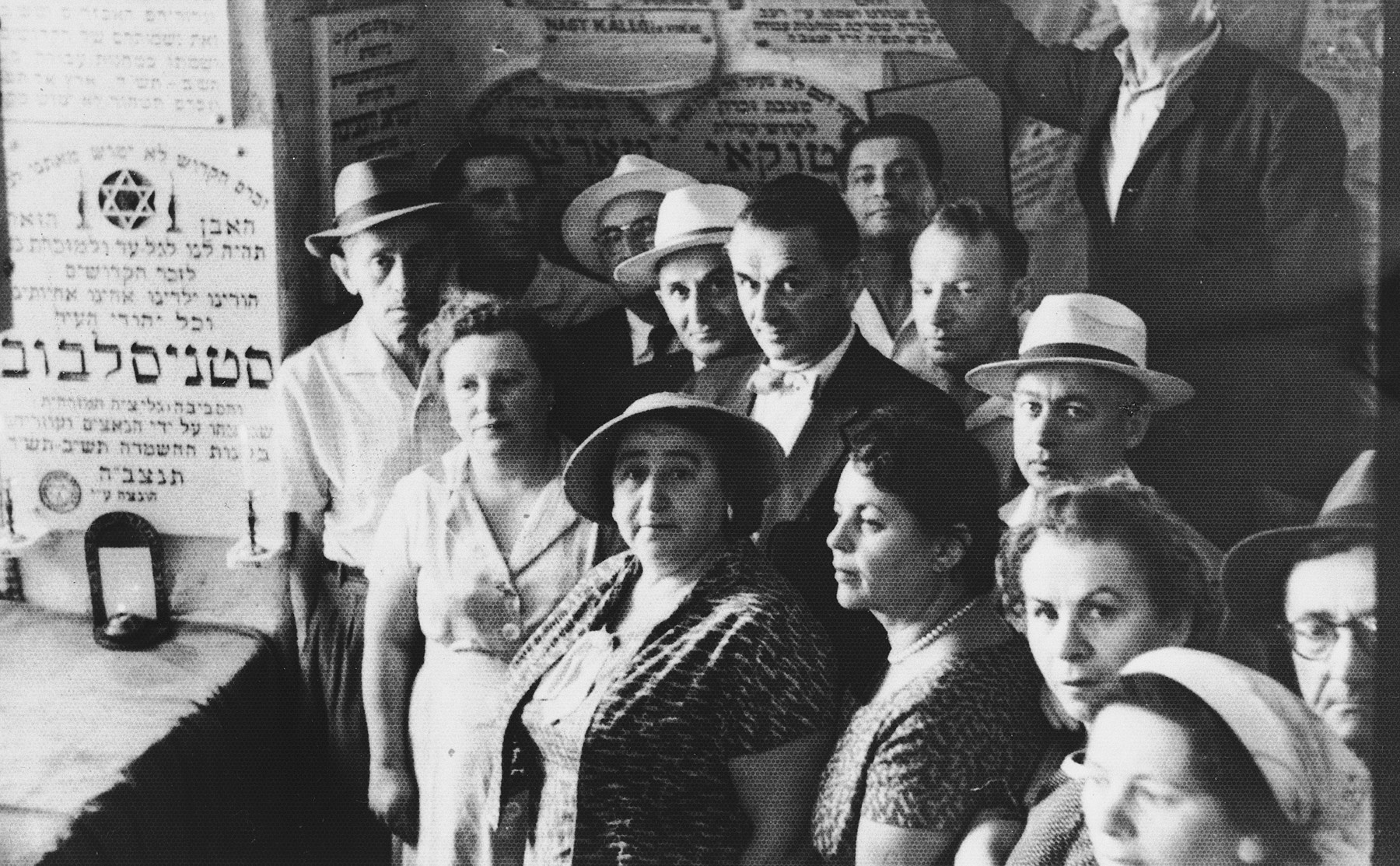 A group of survivors poses next to a memorial tablet commemorating the Jewish victims of Nazism from Stanislawow, Poland.

Among those pictured is Amalie Petranker (lower right corner, second from the bottom).