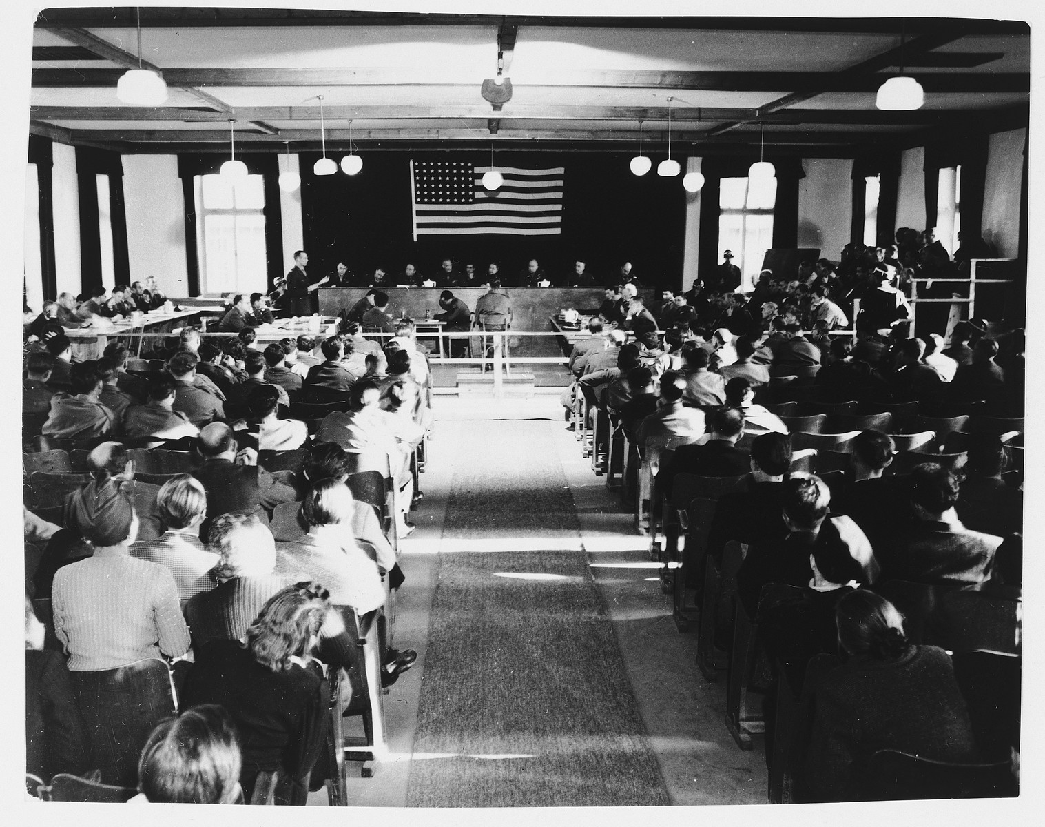 View of the courtroom of the Dachau trial as seen from the back of the room.