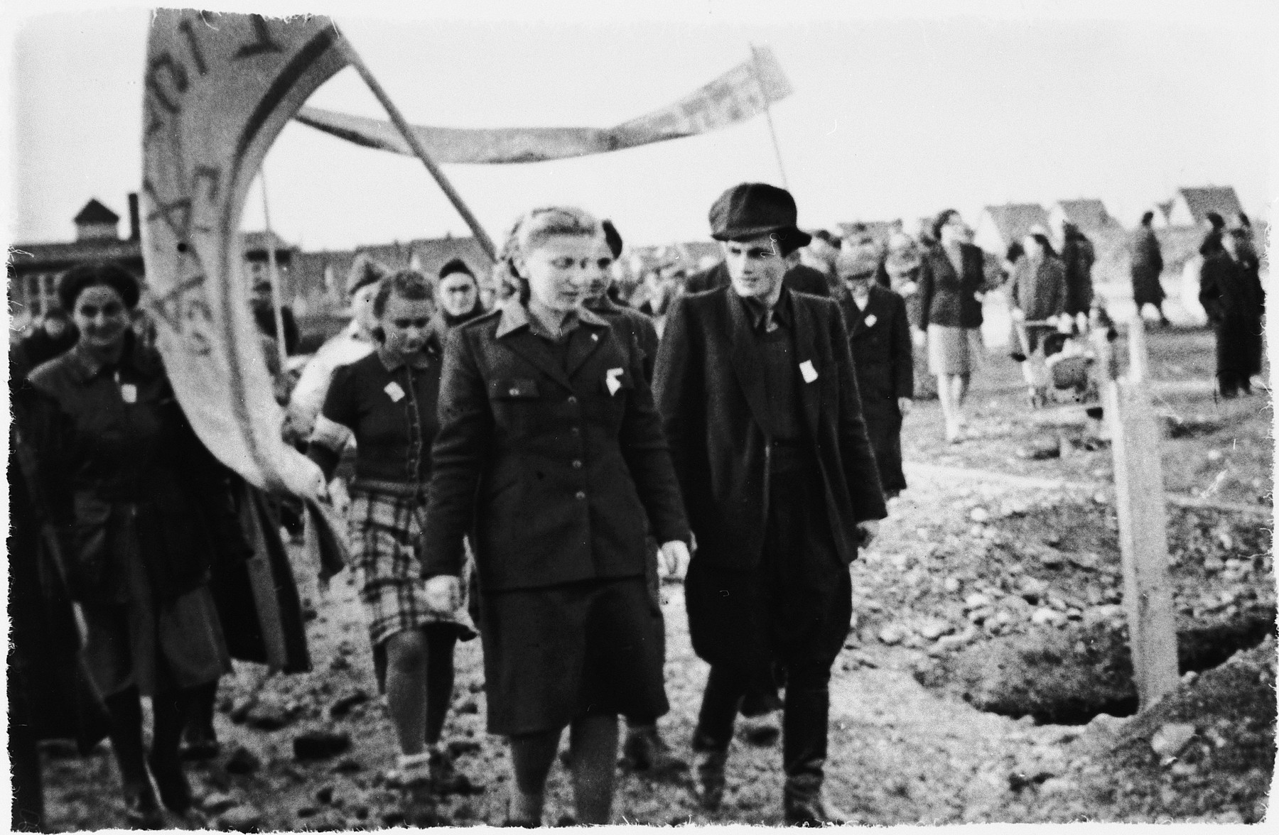 Jewish DPs in the Wels DP camp carrying flags and banner march in a parade to celebrate the partition of Palestine.