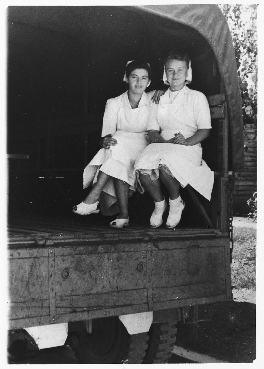 Yehudit Wagner (right) and a friend travel by in the back if a truck to a military hospital near the Wels displaced persons' camp.