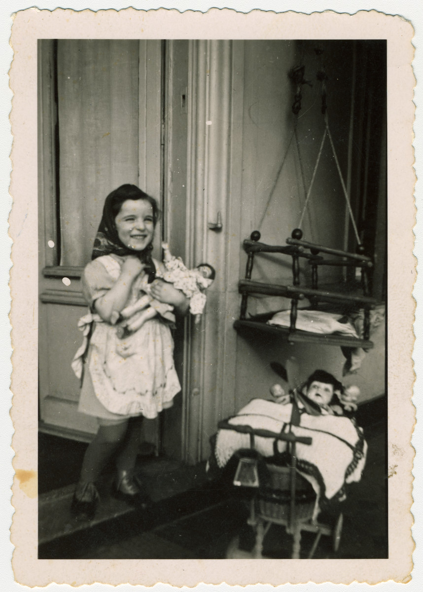 Myriam Manasse, a young German-Jewish girl plays with her dolls about a year before her deportation and murder.

The following year she was deported, presumably to Sobibor where she was killed.