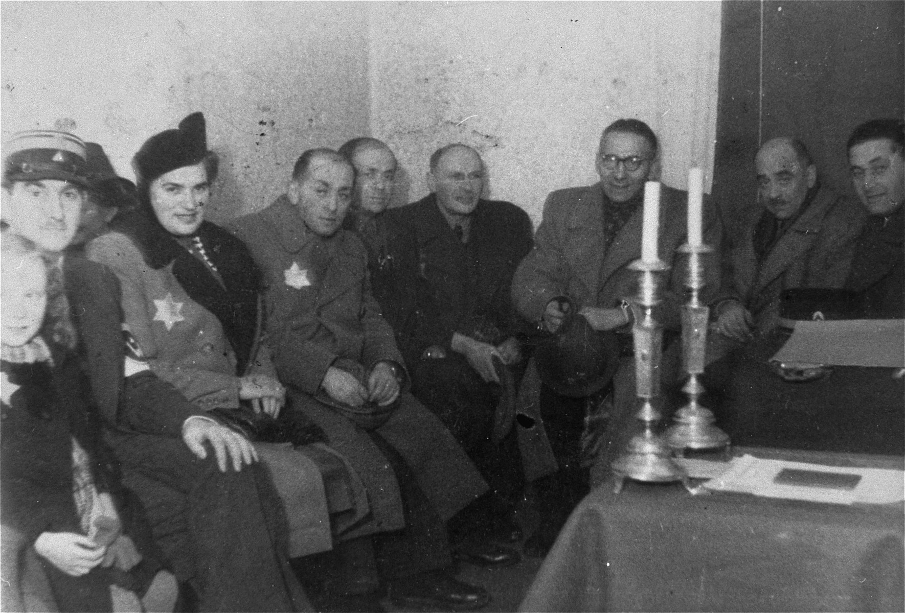 Social gathering in the Marysin police station in the Lodz ghetto.  

Among those pictured are Zeligman (first on the left) and Leon Rozenblat (second from the right).  Baruch Braszker is fourth from the left and [Uberbaum is on the far right.]