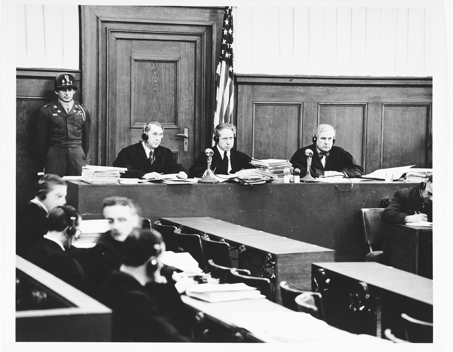 The judges of Military Tribunal II-A, hearing the Einsatzgruppen Trial.  

Pictured from left to right are: John J. Speight, Michael A. Musmanno, and Richard D. Dixon.