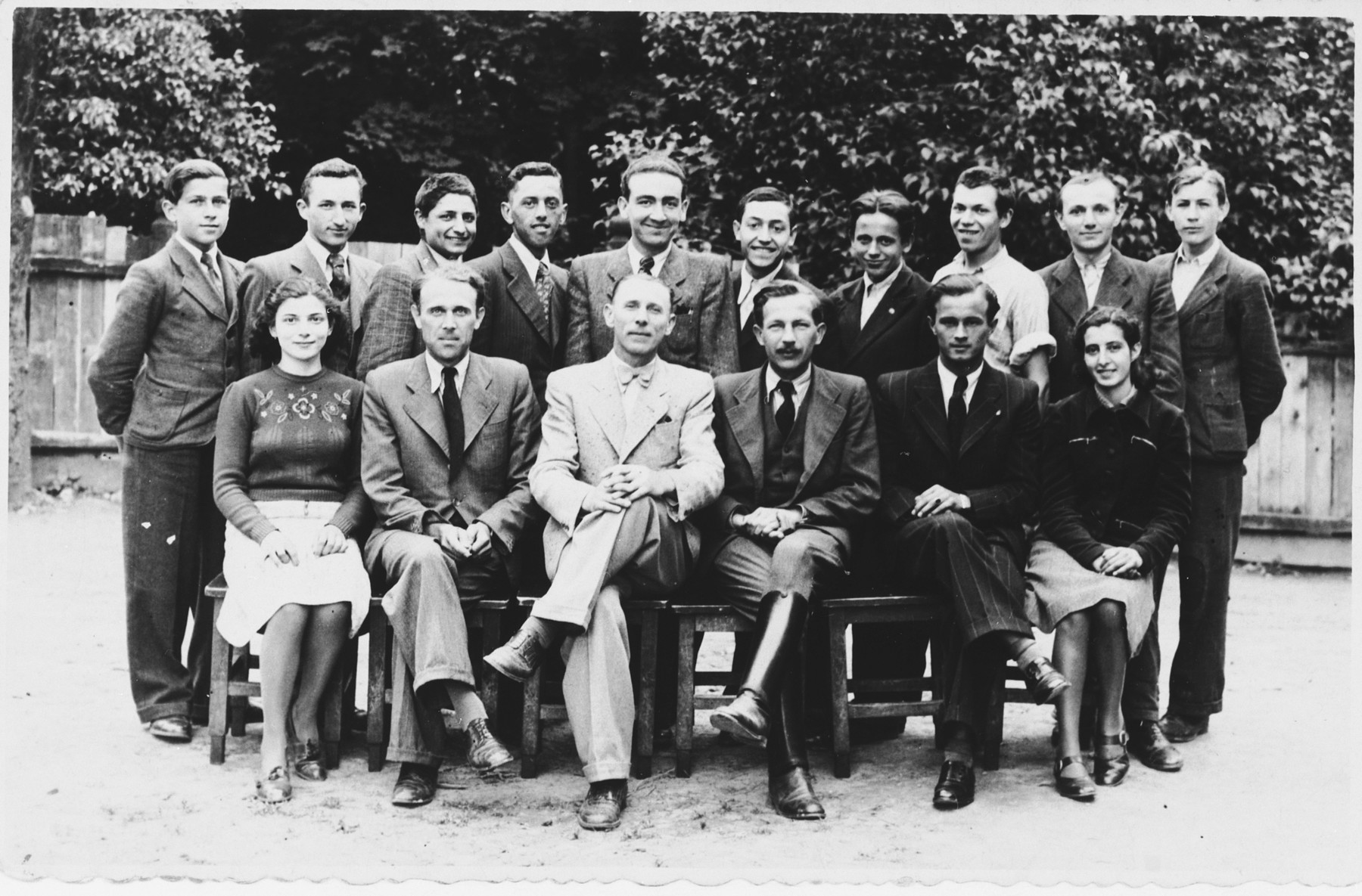 Group portrait of students and faculty at a vocational school in Tacovo.

Among those pictured is Goldie Berger (front row, left).