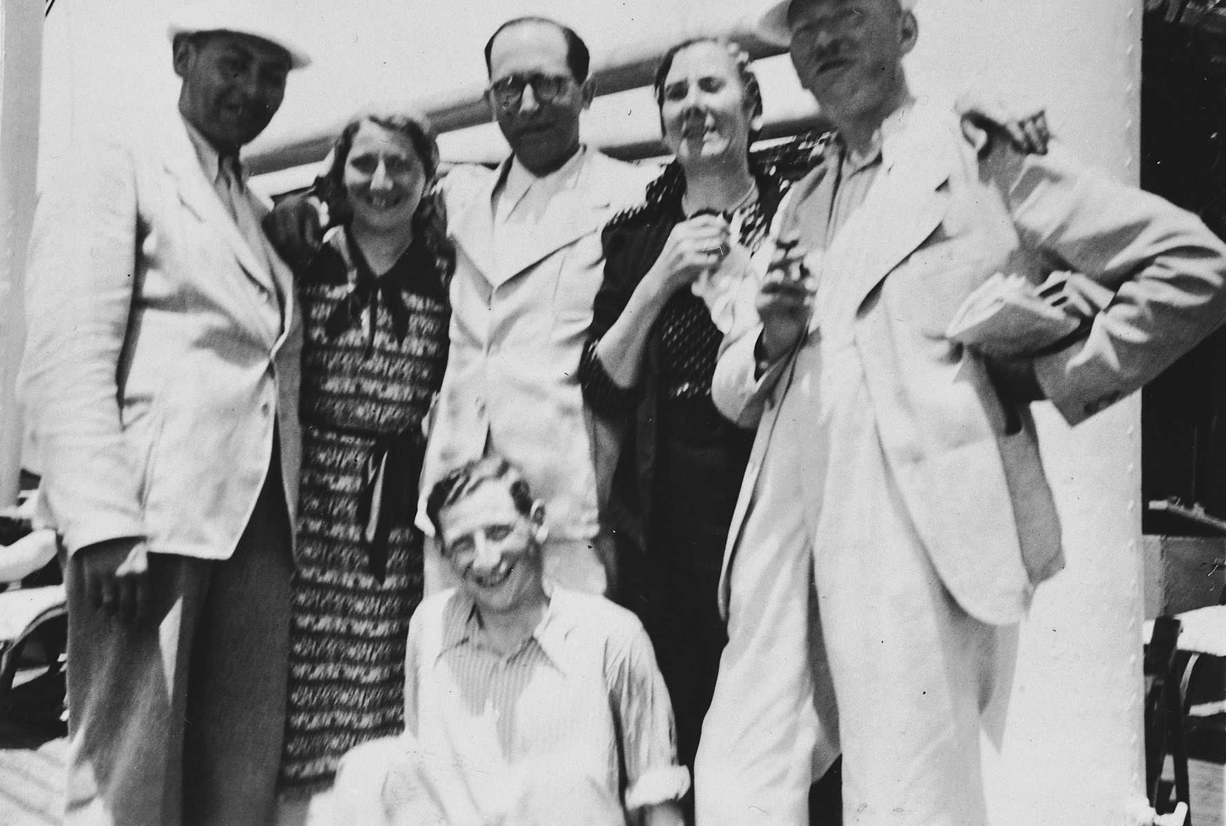 Jewish refugees from Breslau pose on the deck of the St. Louis.

Seated in front is Ernst Meyer.  Standing left to right are Kurt Marcus, Ilse Marcus, a friend from Breslau, Elfriede Meyer, and Berthold Meyer.